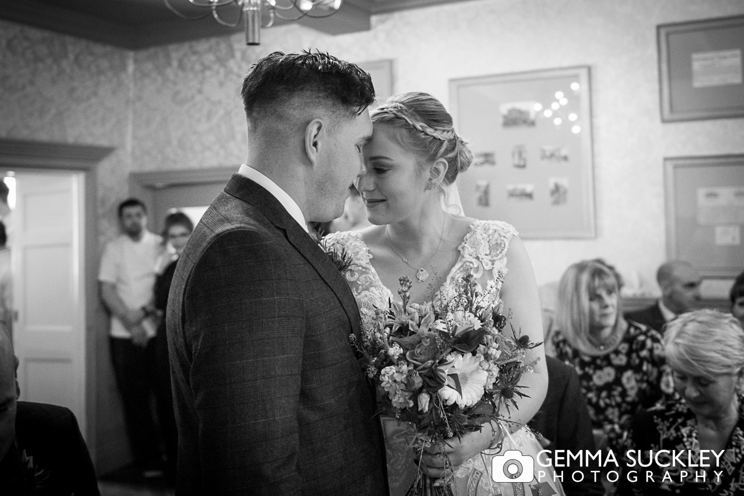 an intimate moment of a bride and groom during their ceremony at grassington house
