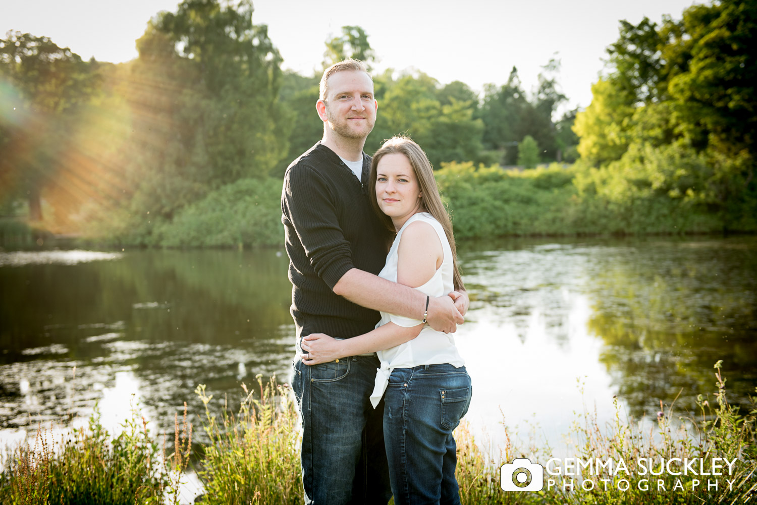 a couple by the lake at golden hour during theit photo shoot at coniston hotel 