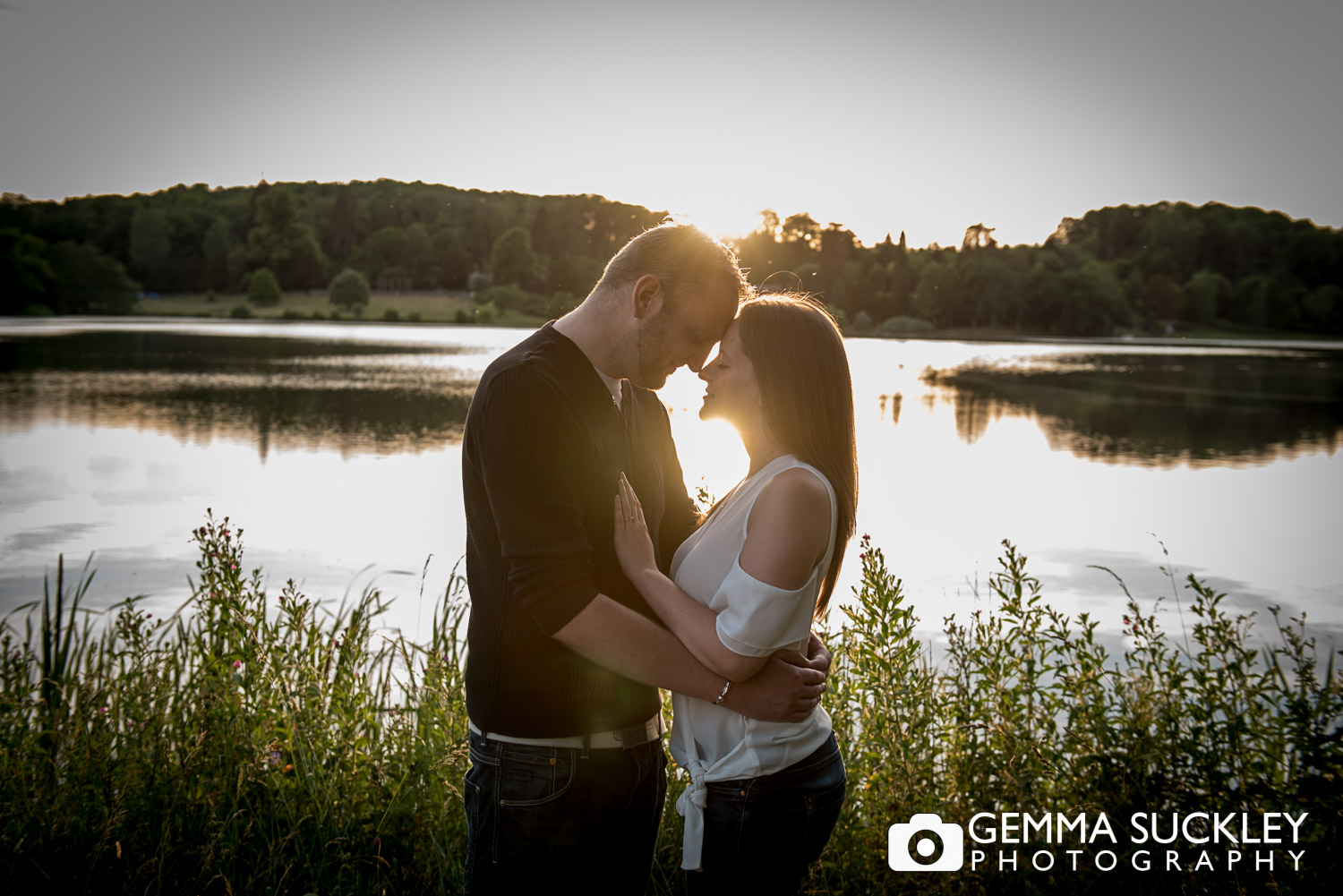 sunsetting at the lake at coniston hotel in north yorkshire during a couple engagement photo shoot 