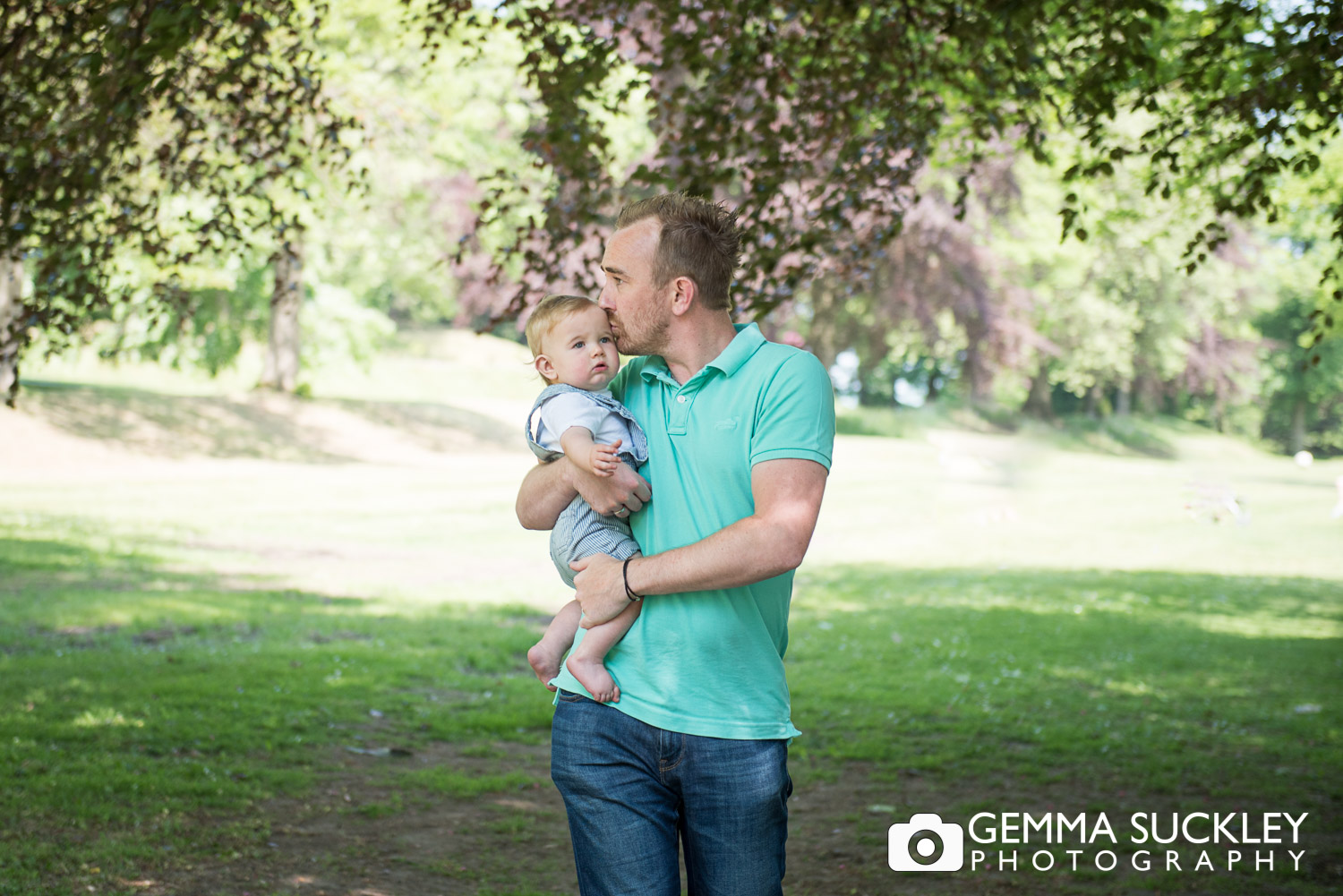 dad kissing his baby son during a skipton family photo shoot