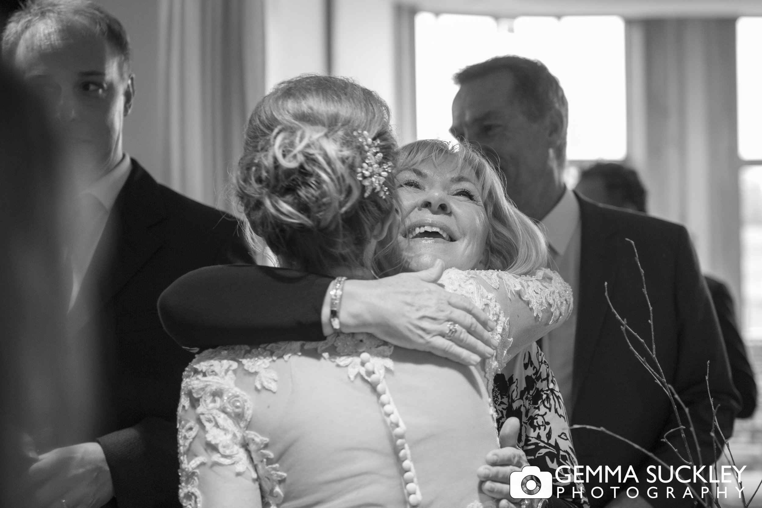bride hugging wedding guest at Grassington house wedding