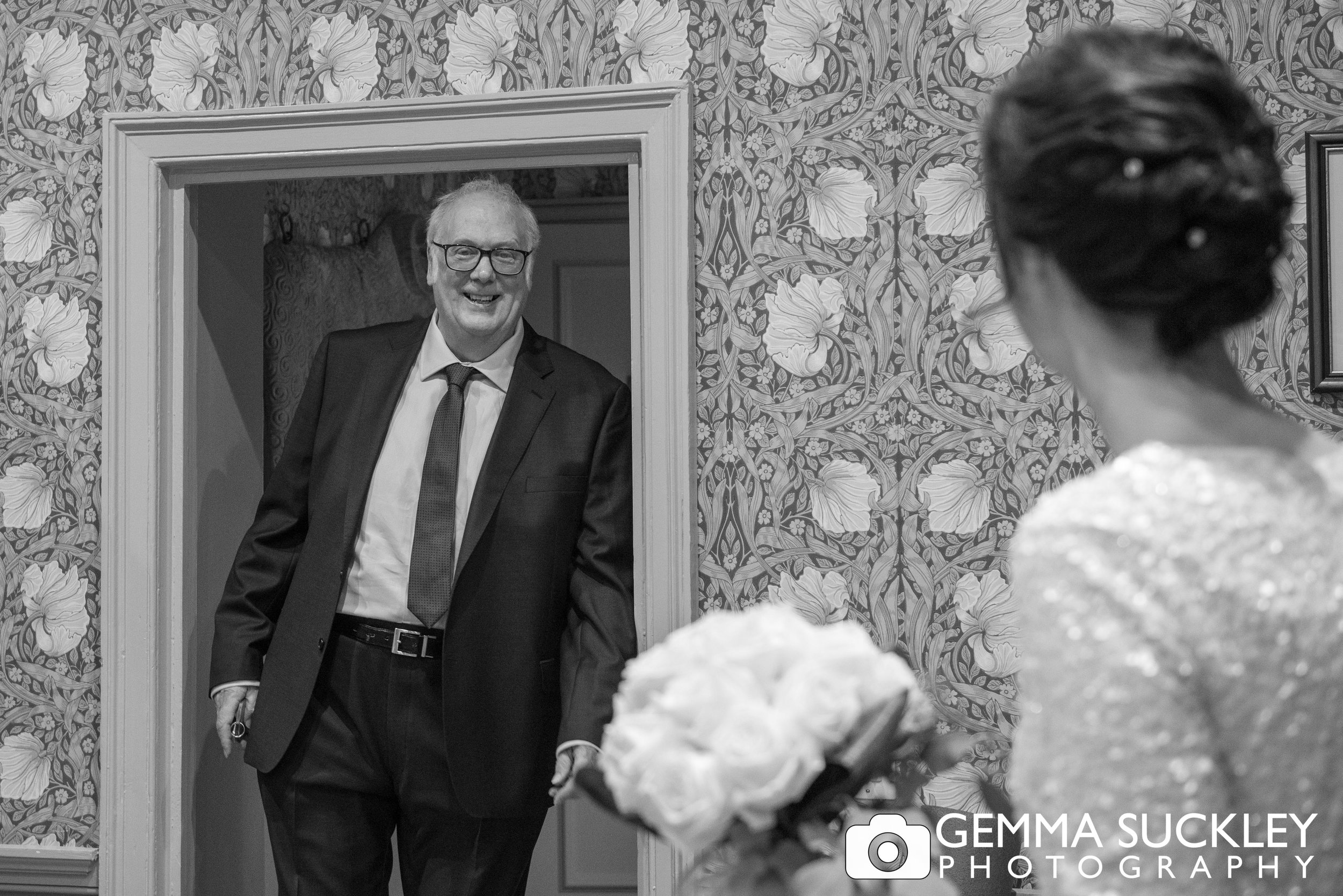 brides father entering the room smiling as he sees his daughter at the devonshire hotel in bolton abbey