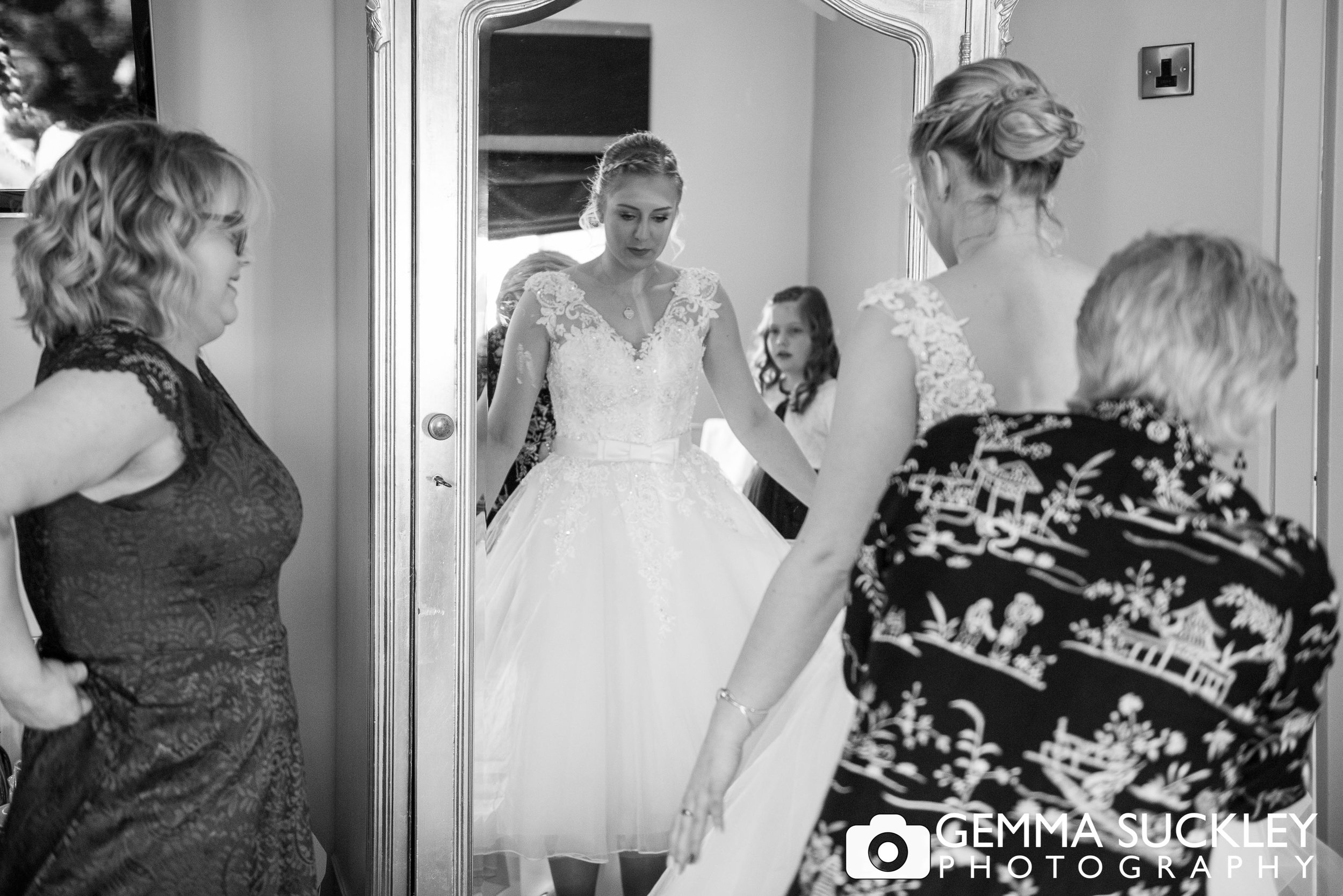 black and white photo of bride in her wedding dress