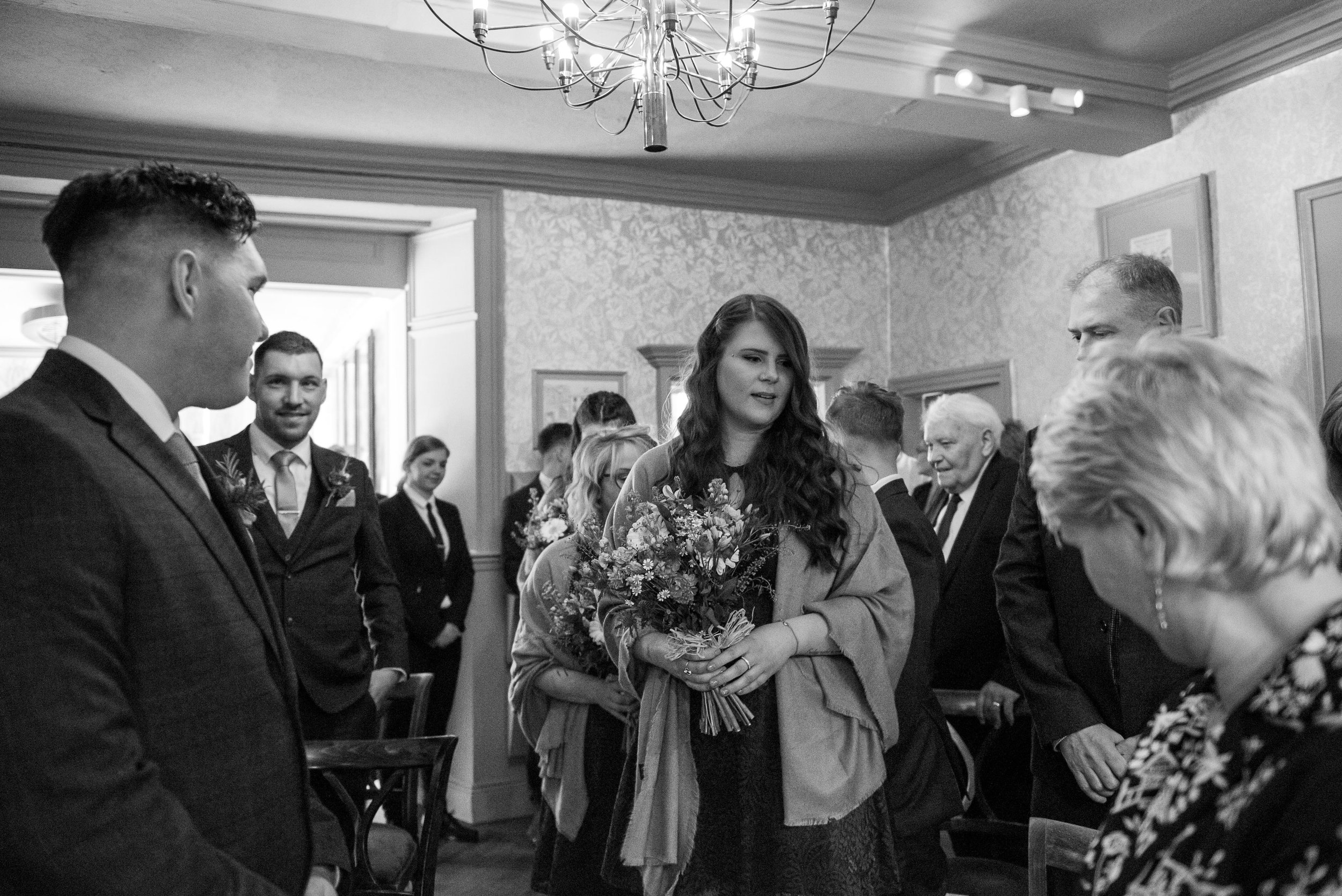 bridesmaid walking down the aisle at grassington house