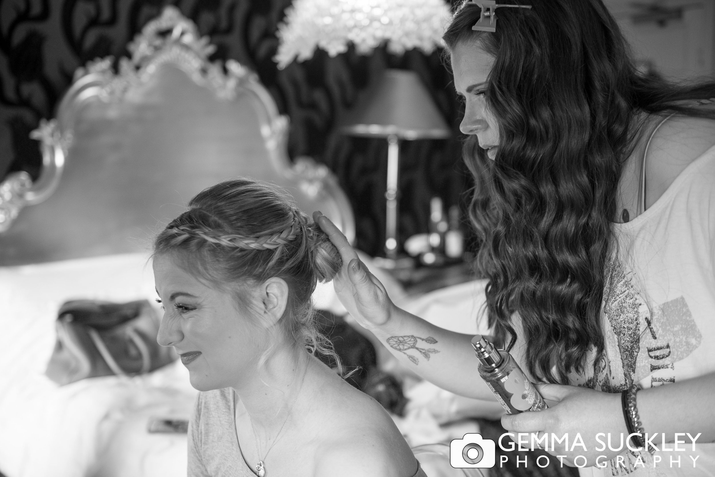 natural photo of bride getting the hair done at grassington house