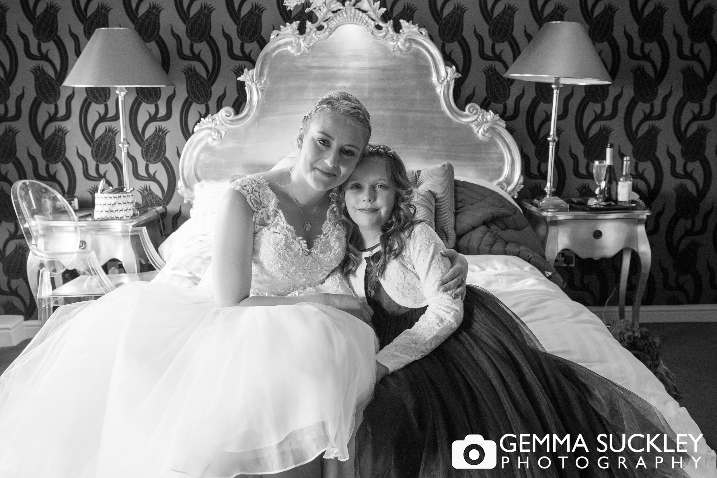 bride with flower girl at gassington house before the ceremony