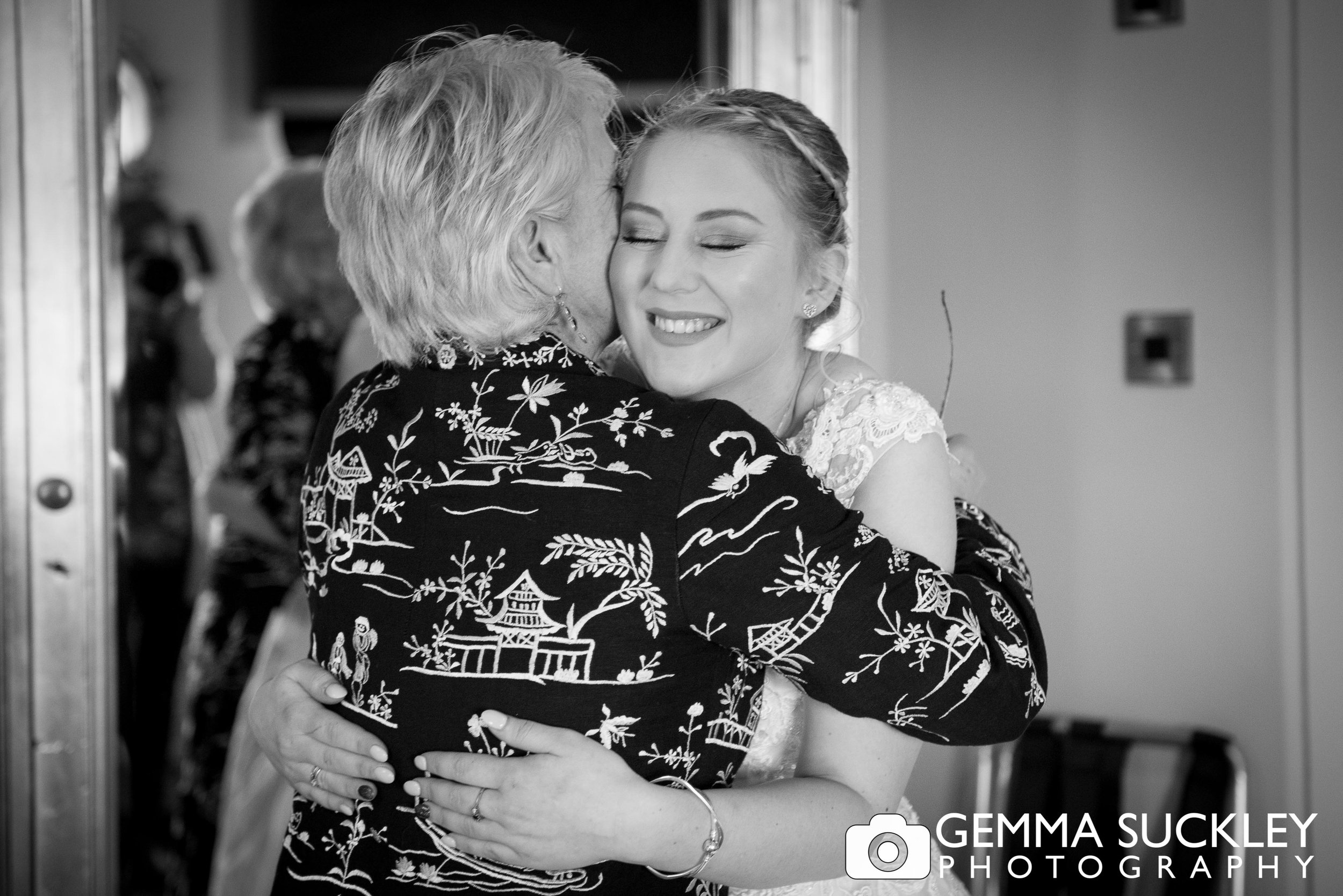 bride hugging her mum at grassington house