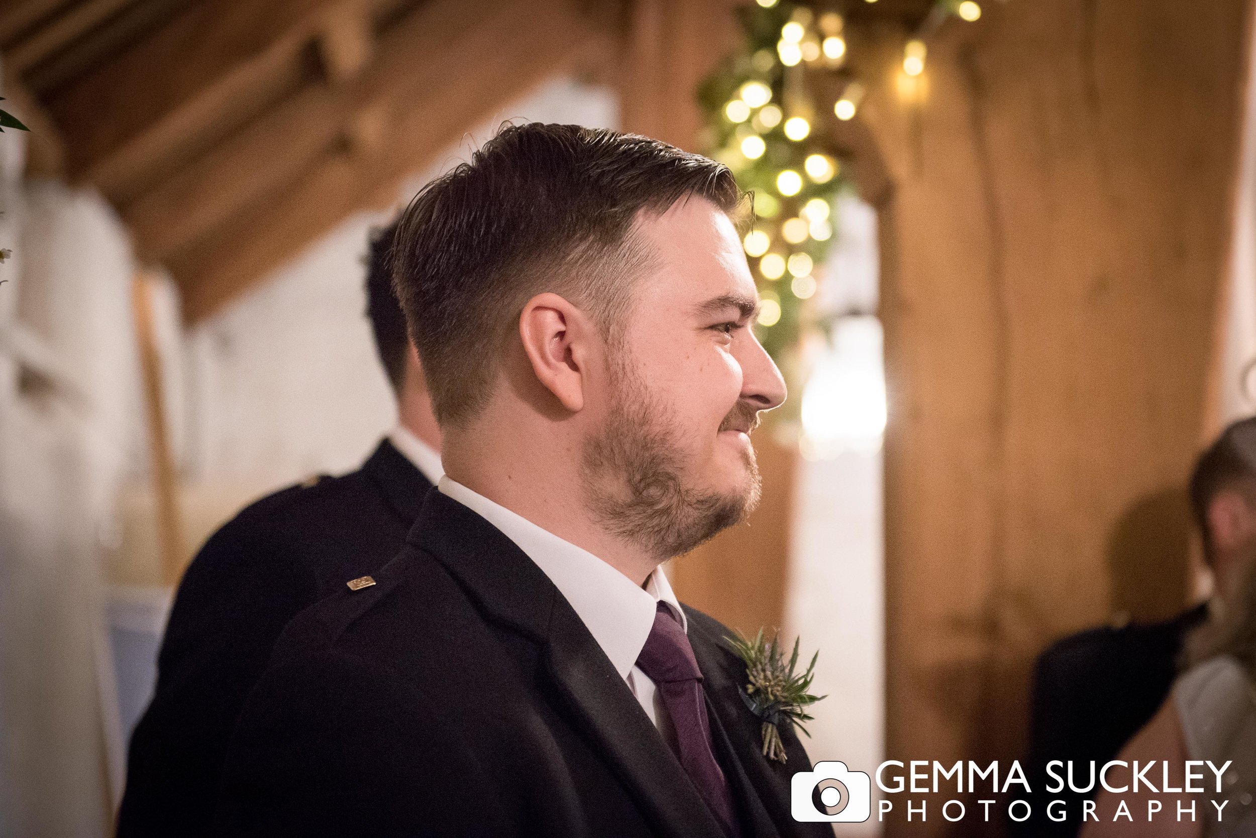 close up photo of the groom at east riddlesden hall