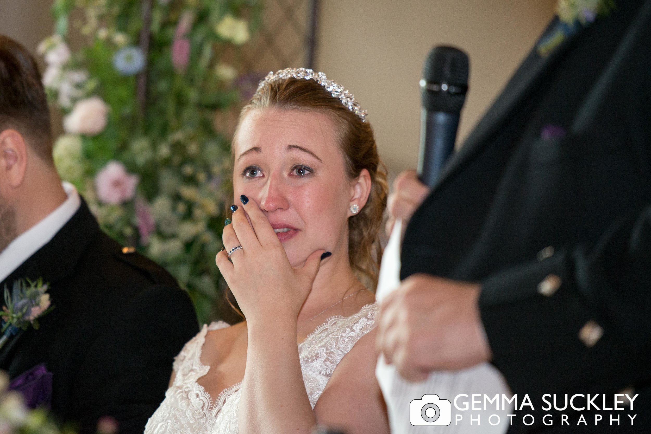 bride crying during her dad's wedding speech