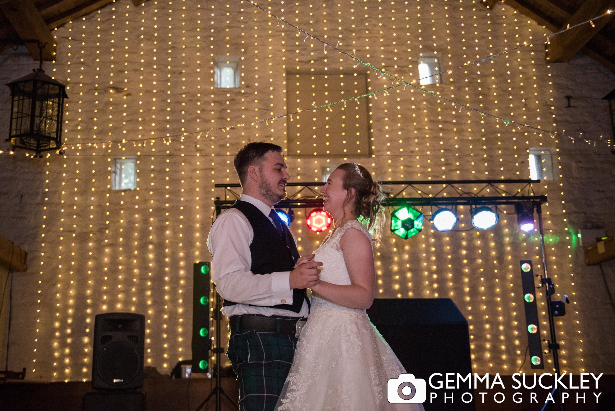 bride and groom first dance at east riddlesden hall