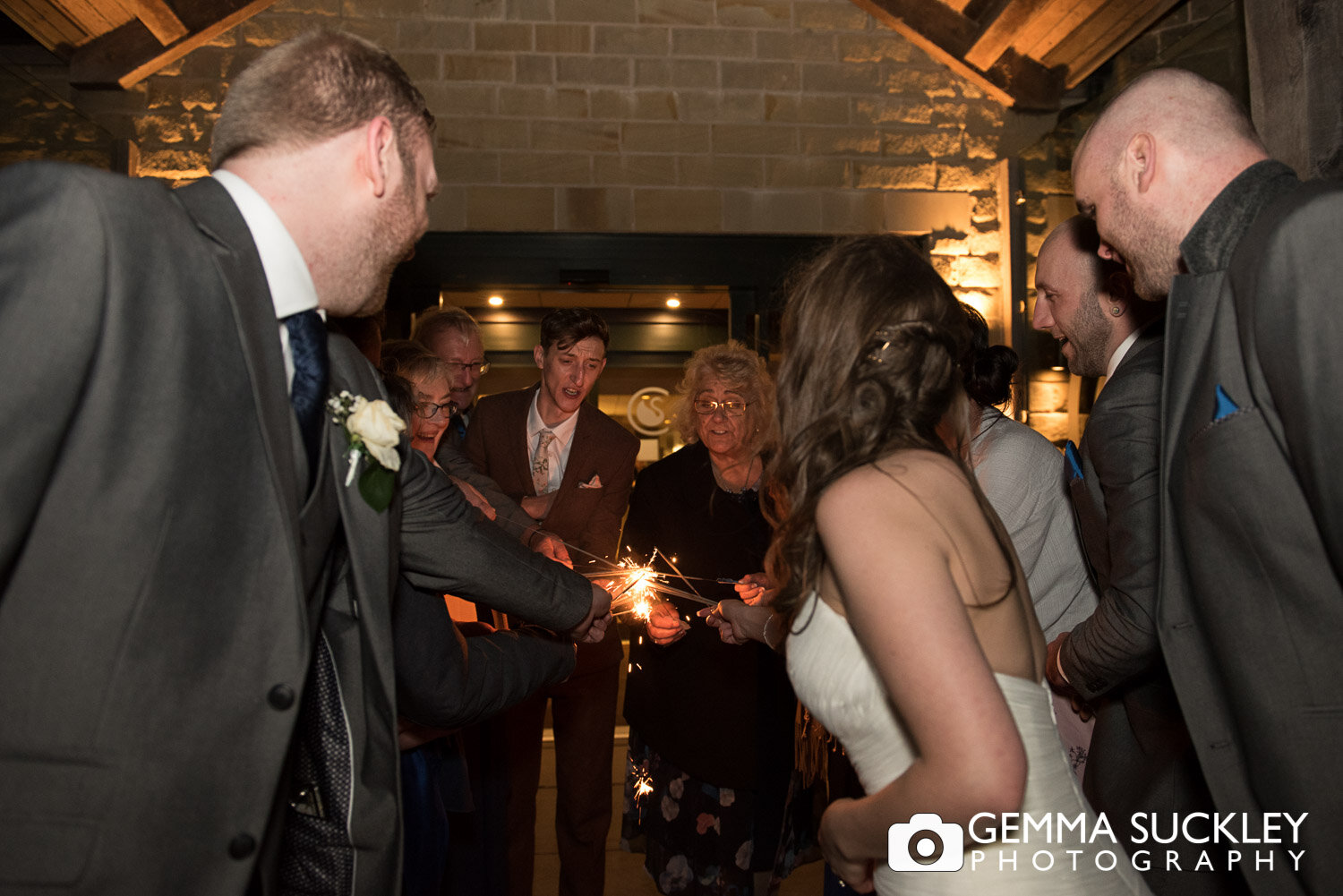 wedding guest lighting sparklers outside coniston hotel