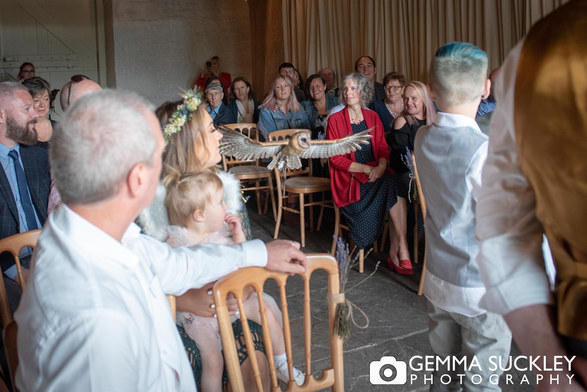 a owl flying through the bar at east riddlesden hall to deliver the wedding rings