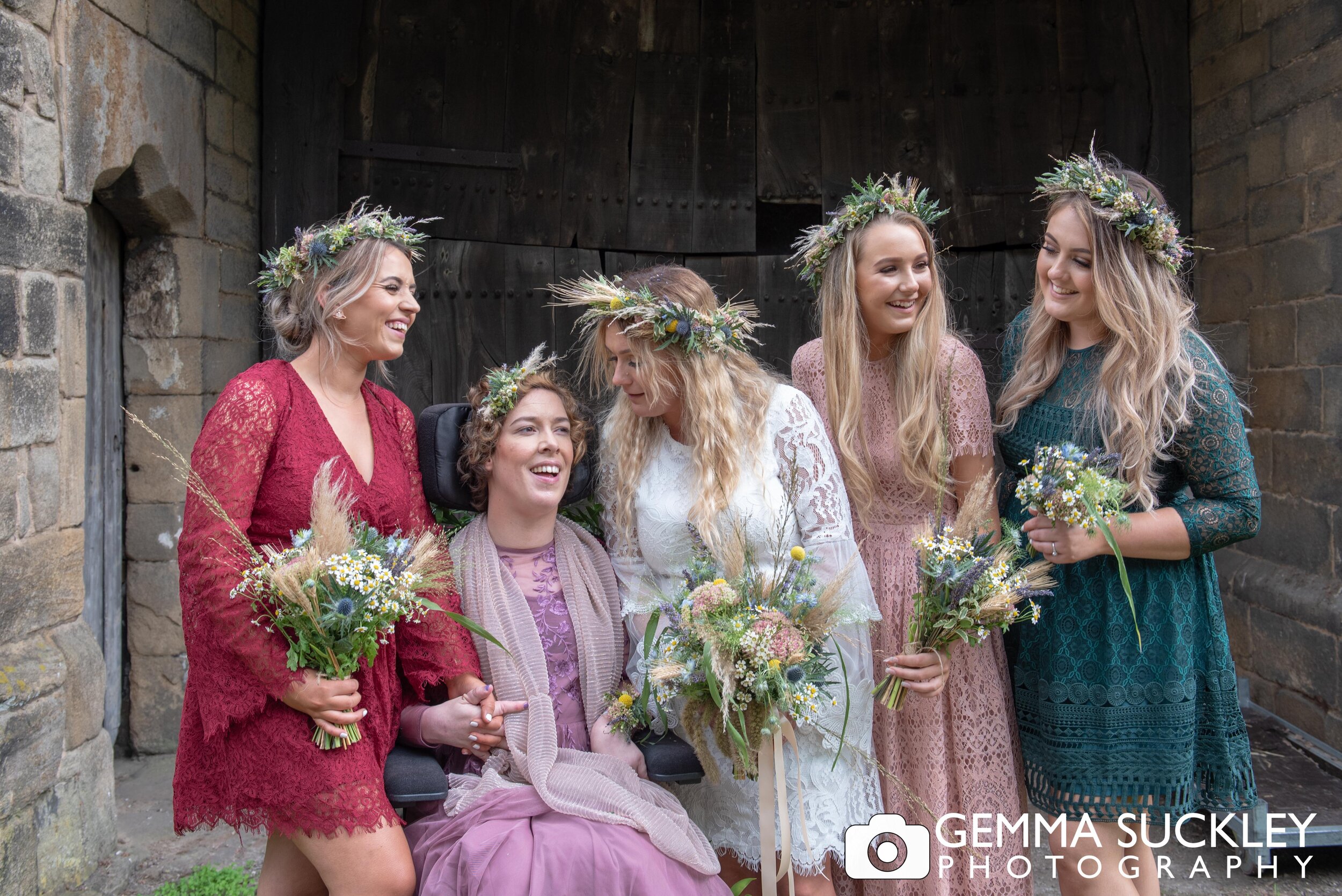 bride and bridemaids in boho dresses and floral crowns