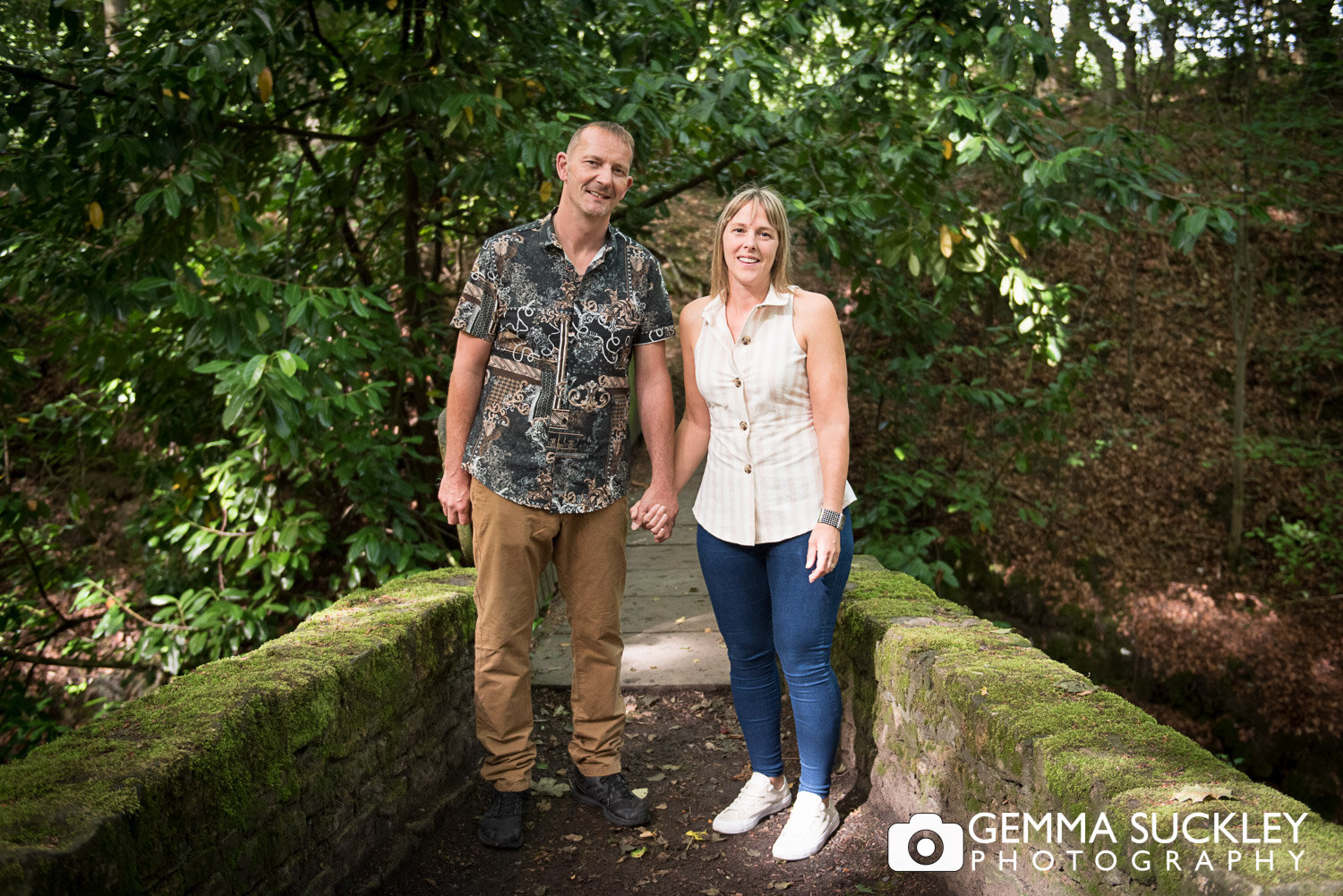 husband and wife smiling for their photo in sutton clough wood