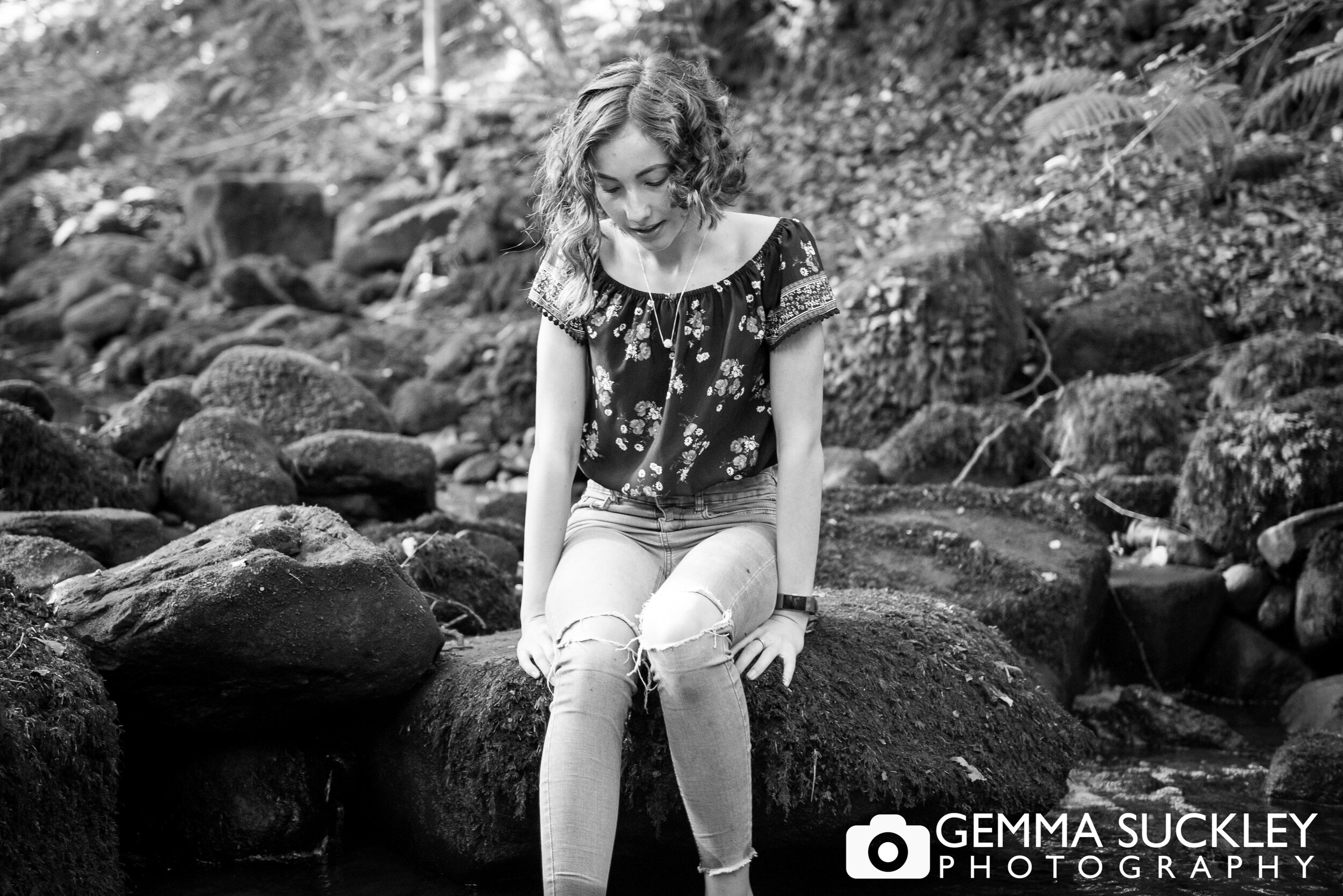 natural black and white photo of a teenage girl during a family photo shoot