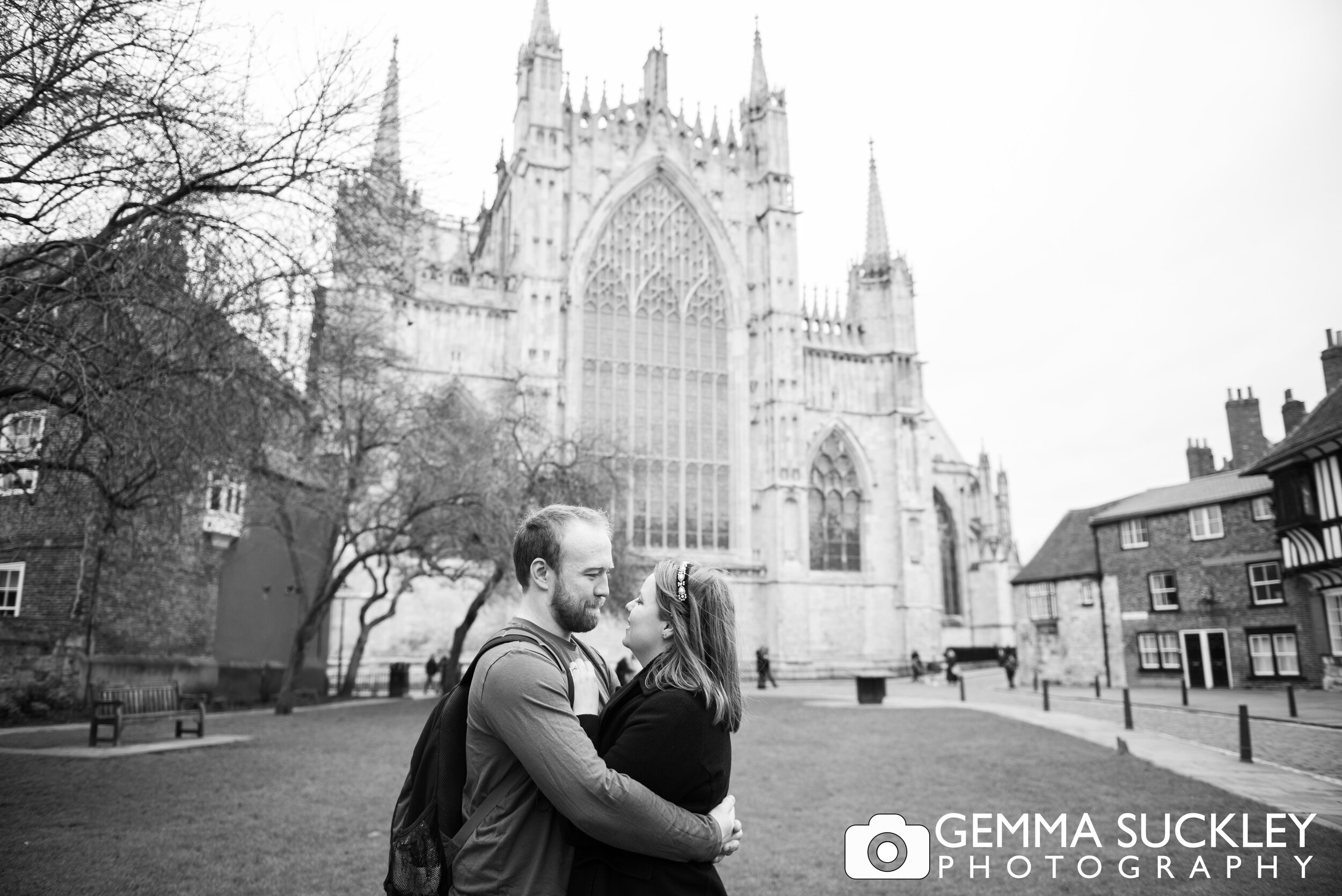 black and white photo of an engaged couple at york minster