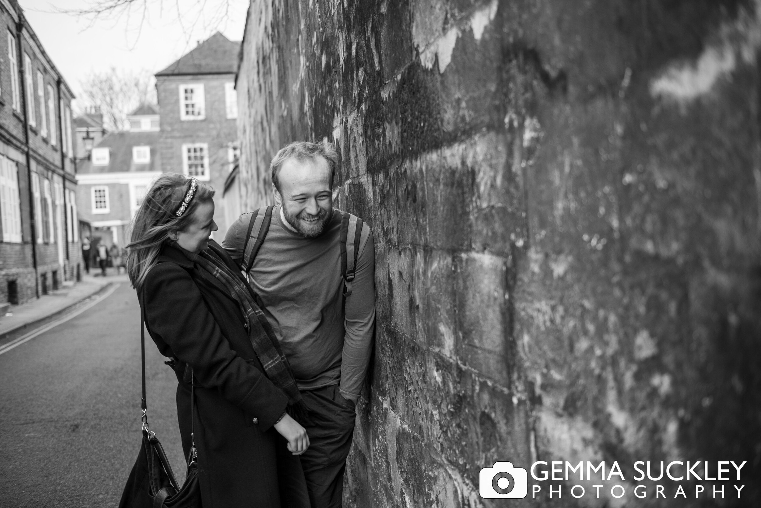 a pre wedding photo of a couple laughing on york