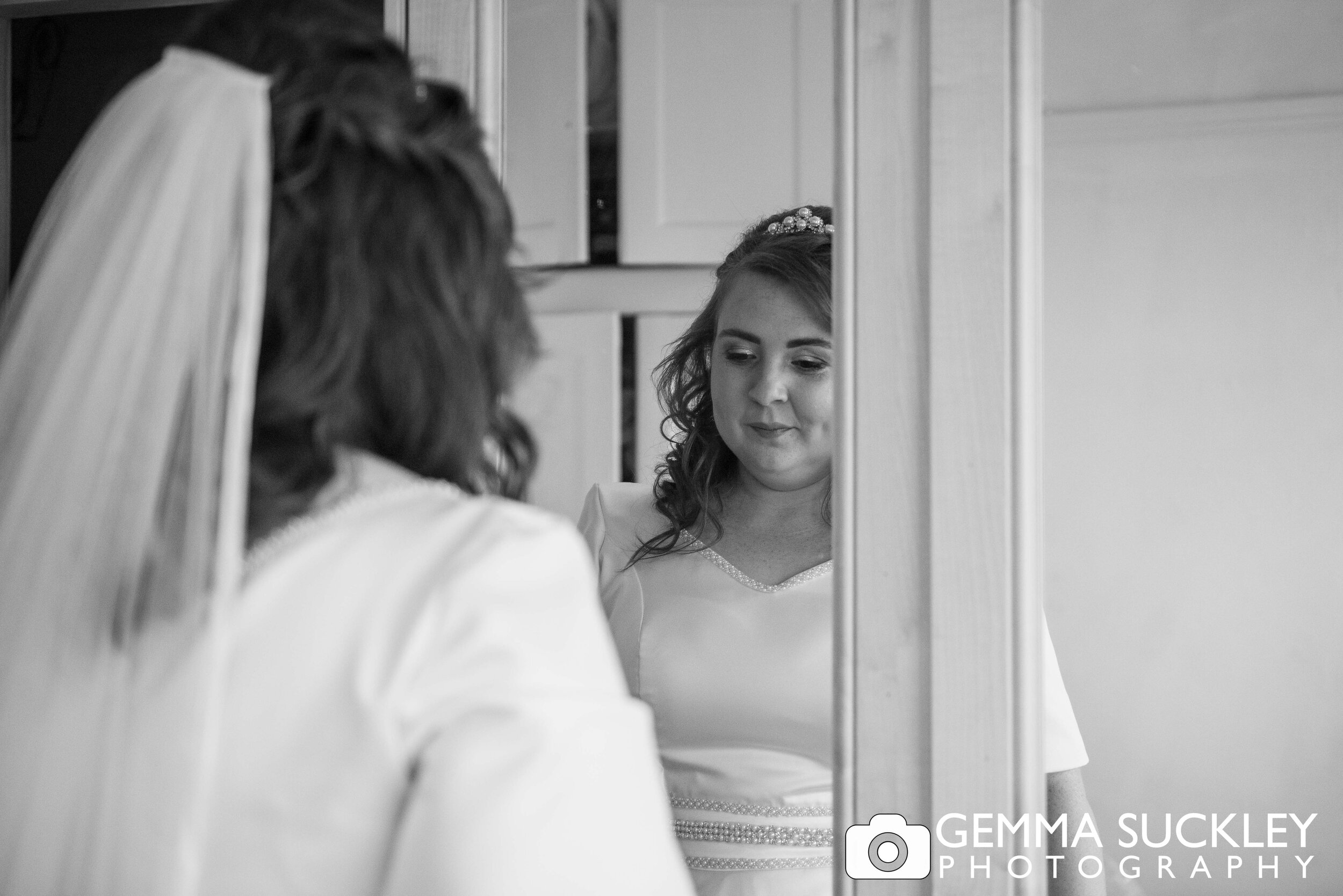 hawoth bride looking in the mirror pre wedding
