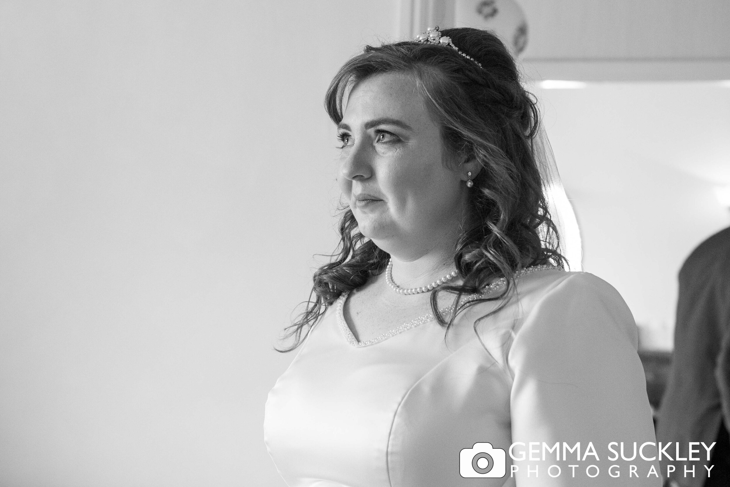 bride prior to wedding looking emotional