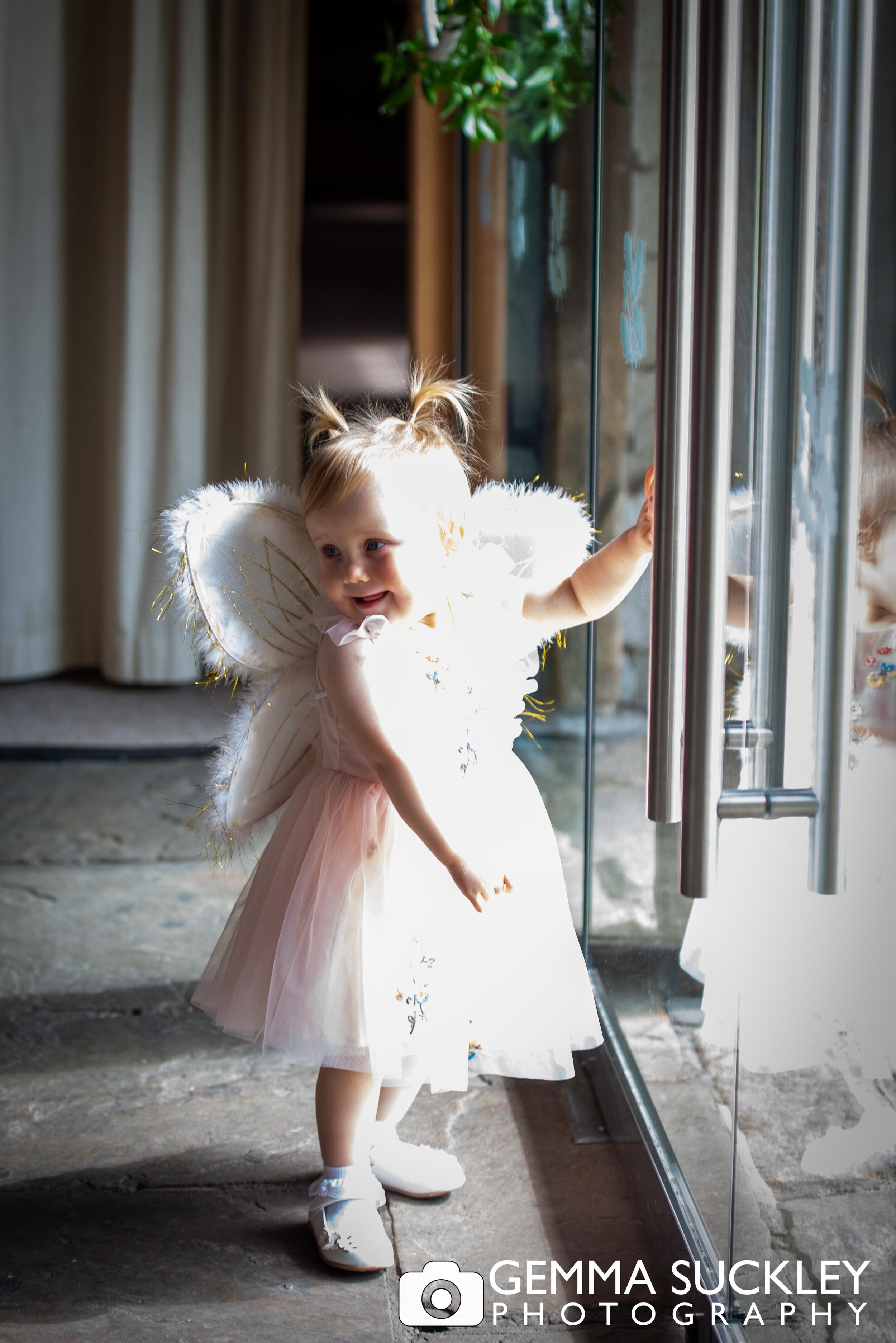 toddler flower girl trying to escape at east wedding hall barn wedding