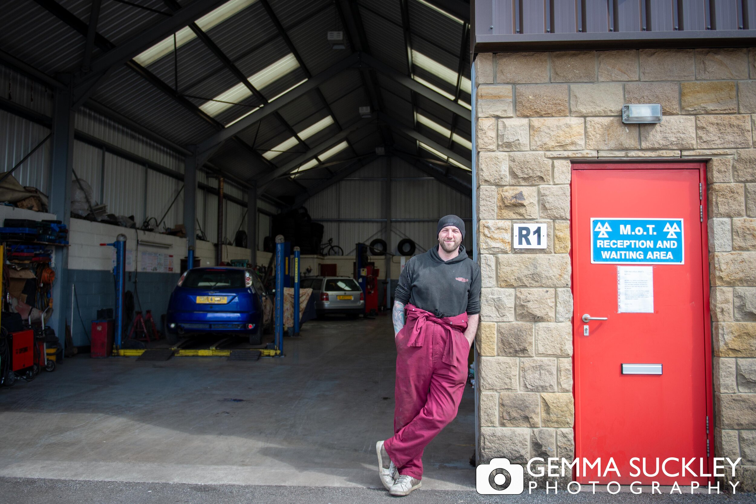 mechanic  in cross hills smiling for a doorstep photo