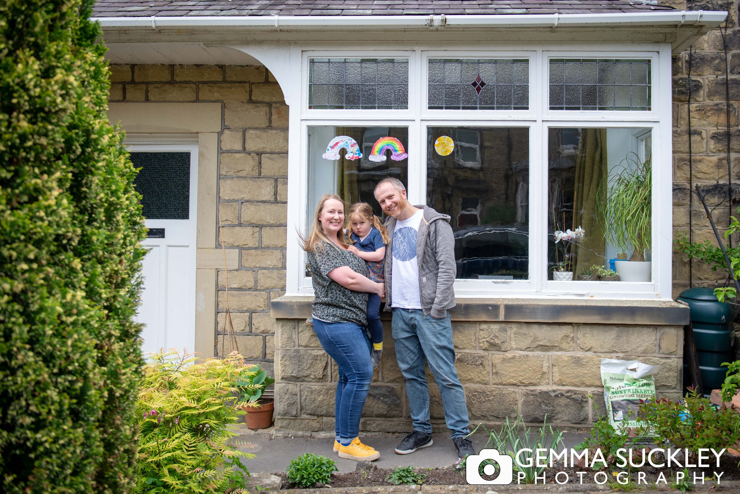 skipton couple and their kids smiling outside their house for a photo