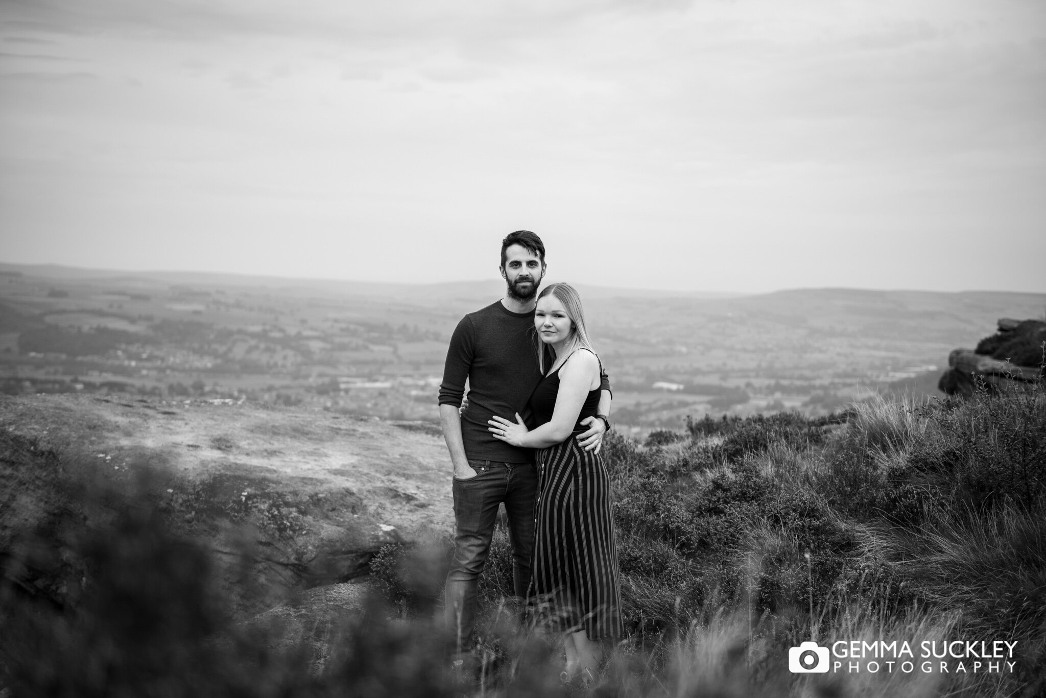 black and white photo of a couple smiling for their engagement shoot