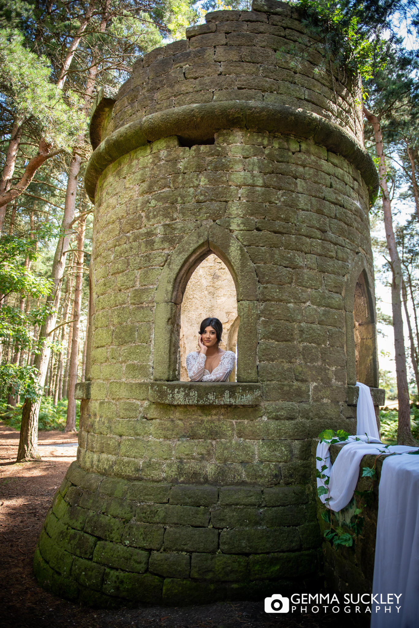 a bride at the window of the folly in harden wood
