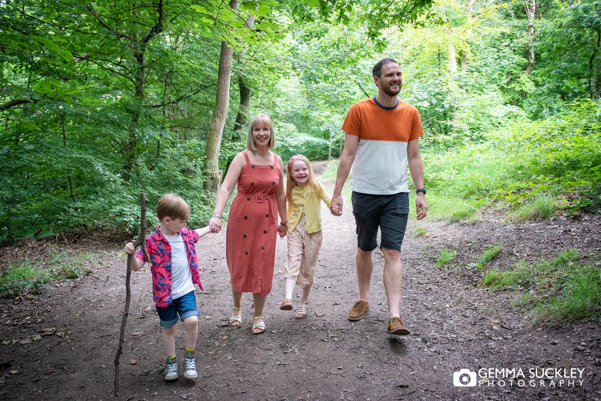 natural photo of a family of four walking at the otely chevin