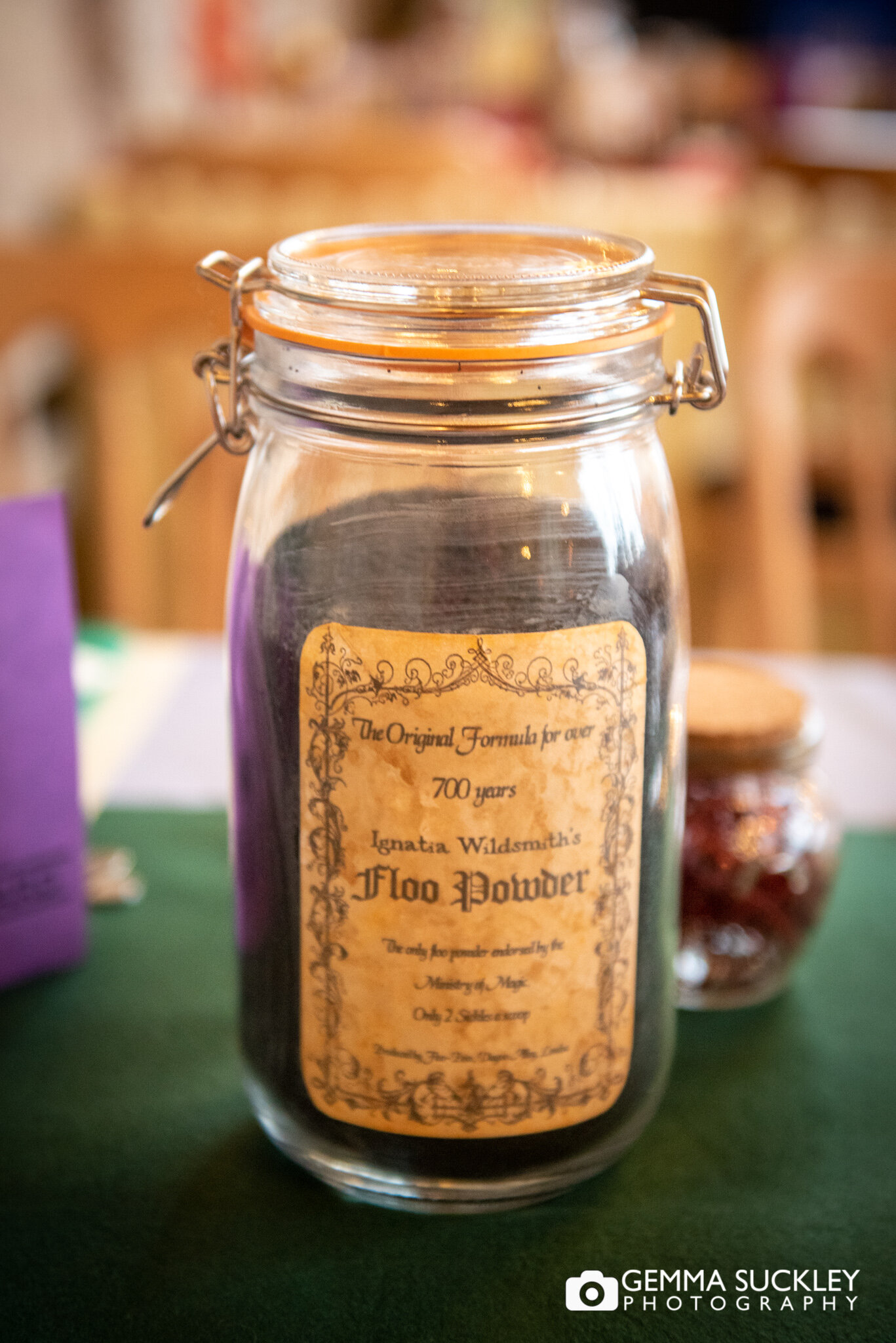 a jar of floo powder at a harry potter themed wedding