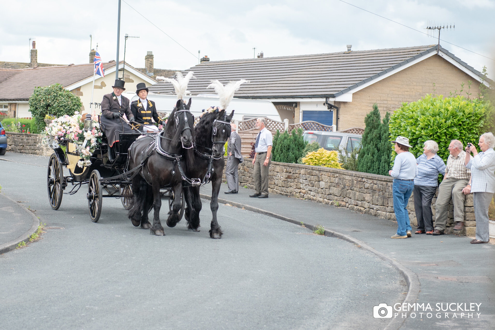a horse and carriage approaching the brides house in skipton