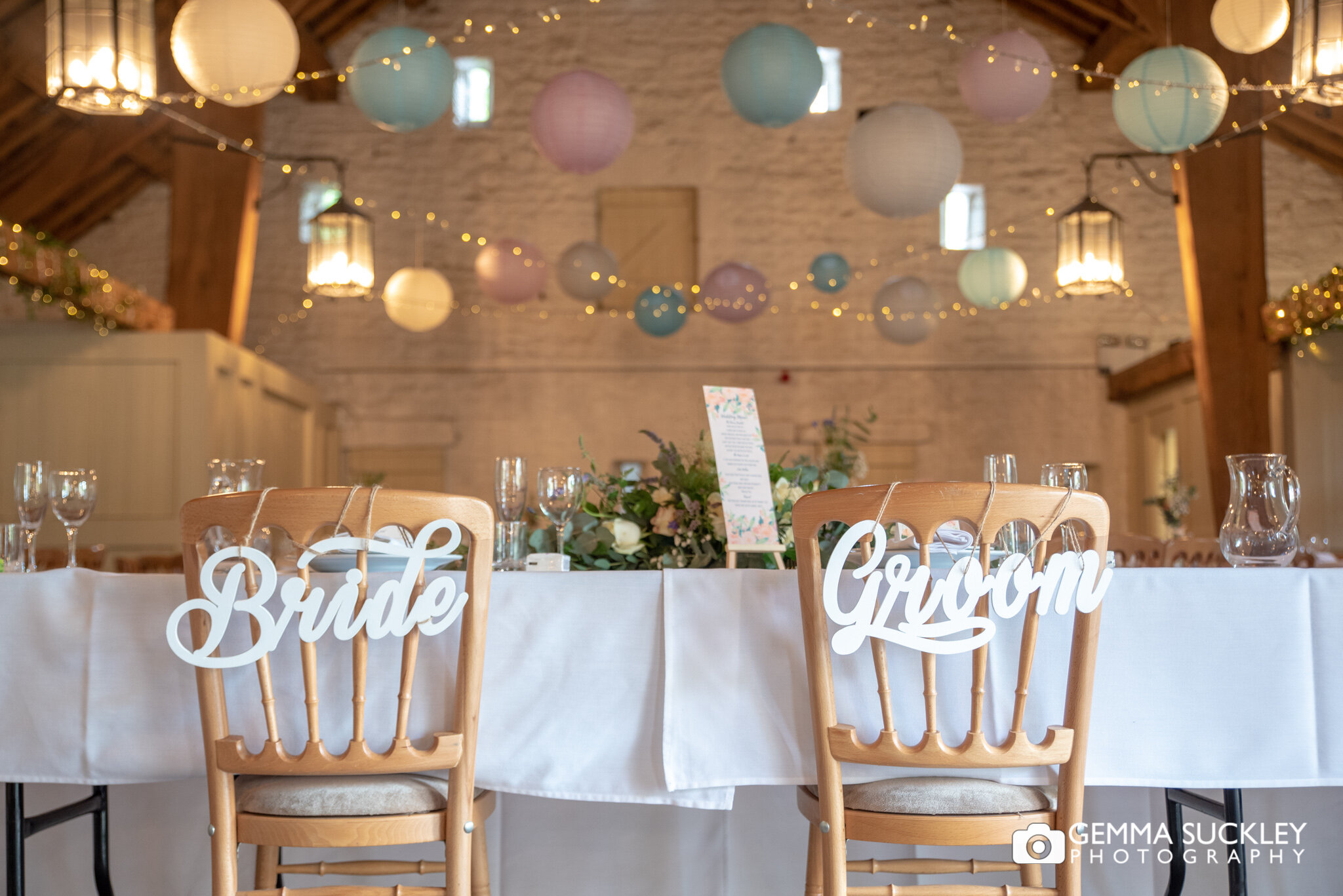 a bride and groom chair signs hung at east riddlesden hall wedding
