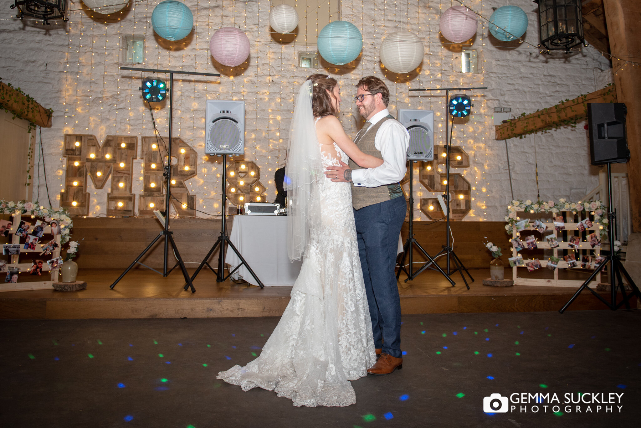 the bride and groom dance their first dance together at east riddlesden hall 