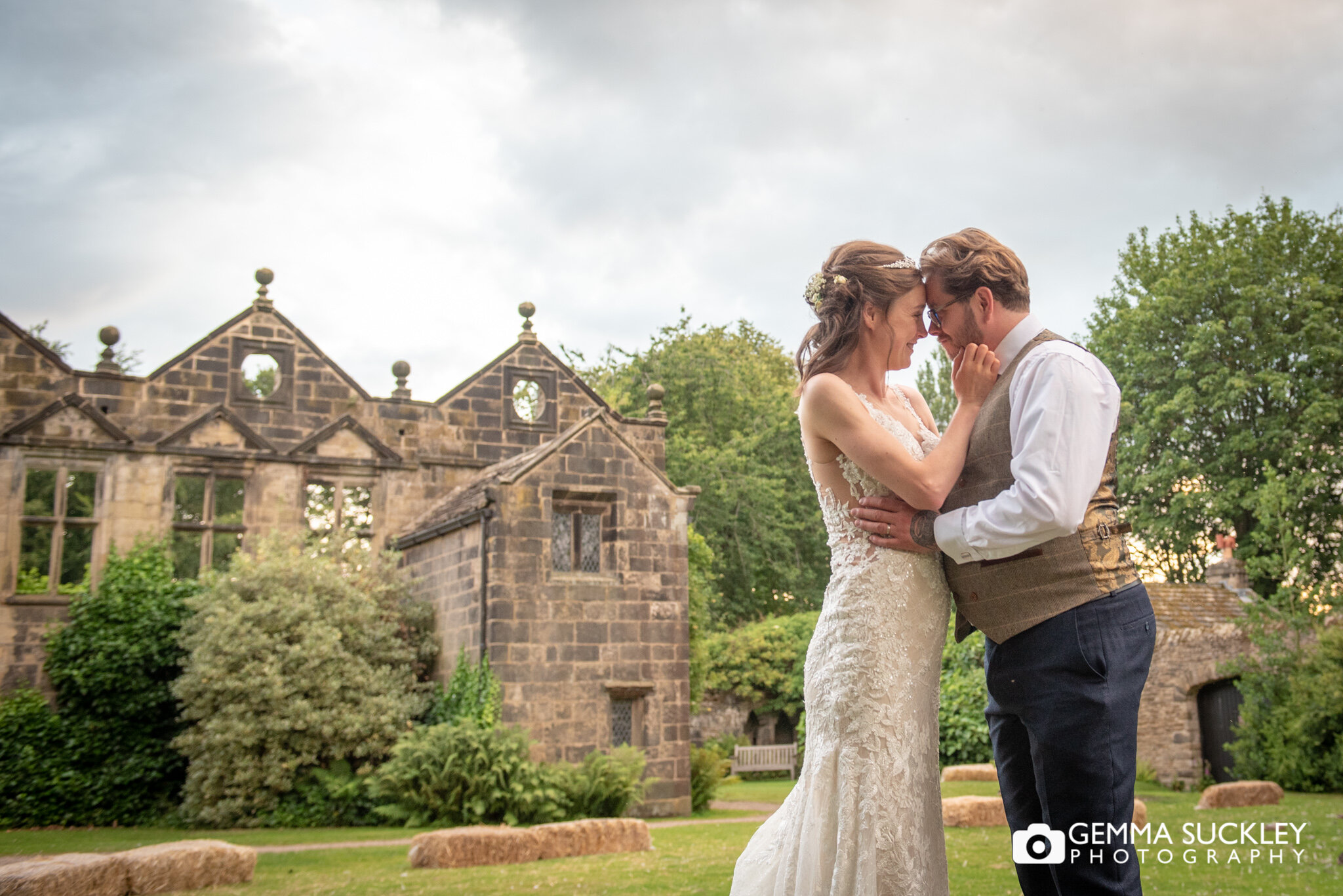sunsetting at east riddlesden hall ruin as the bride and groom 