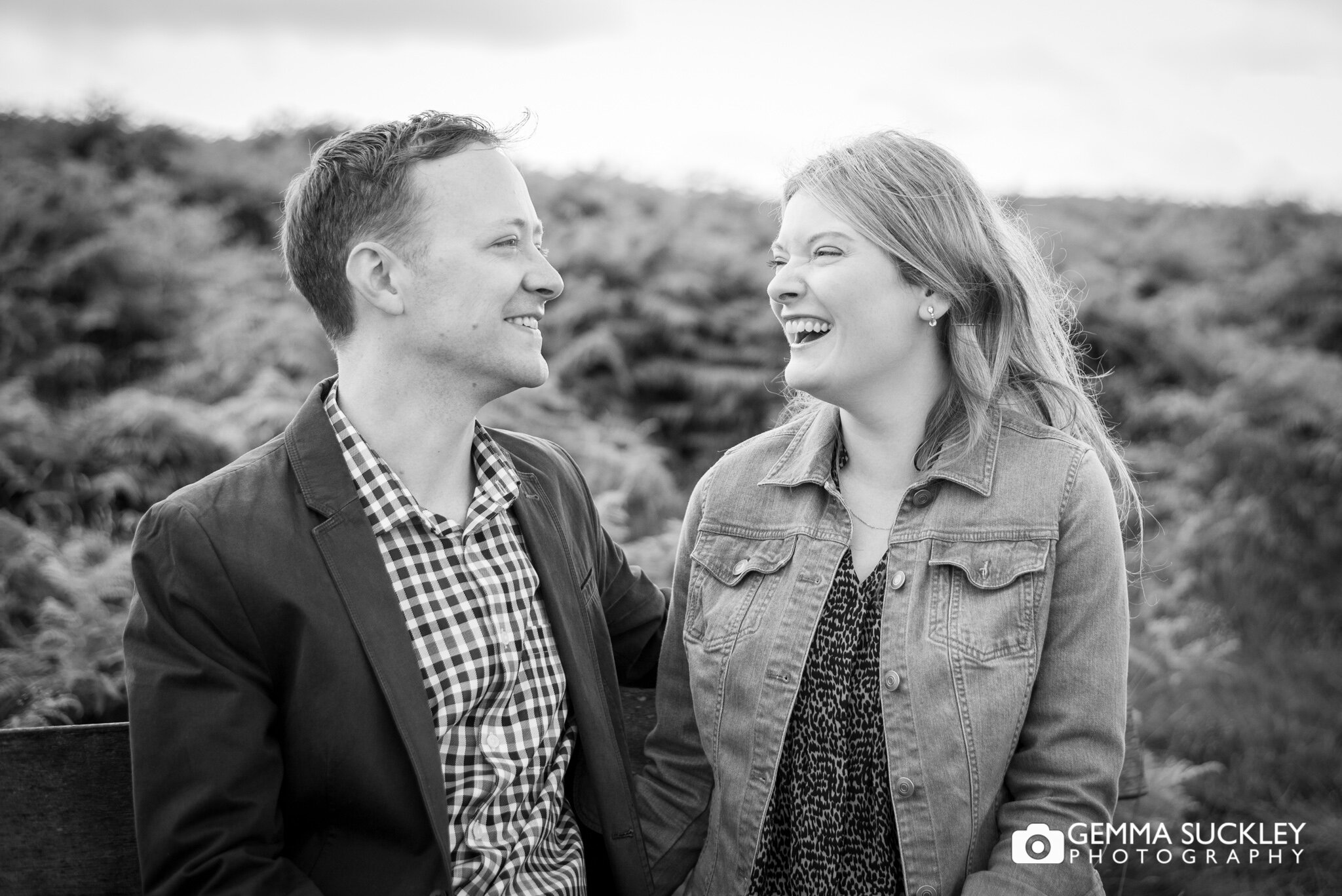 black and white natural photo of a laughing couple