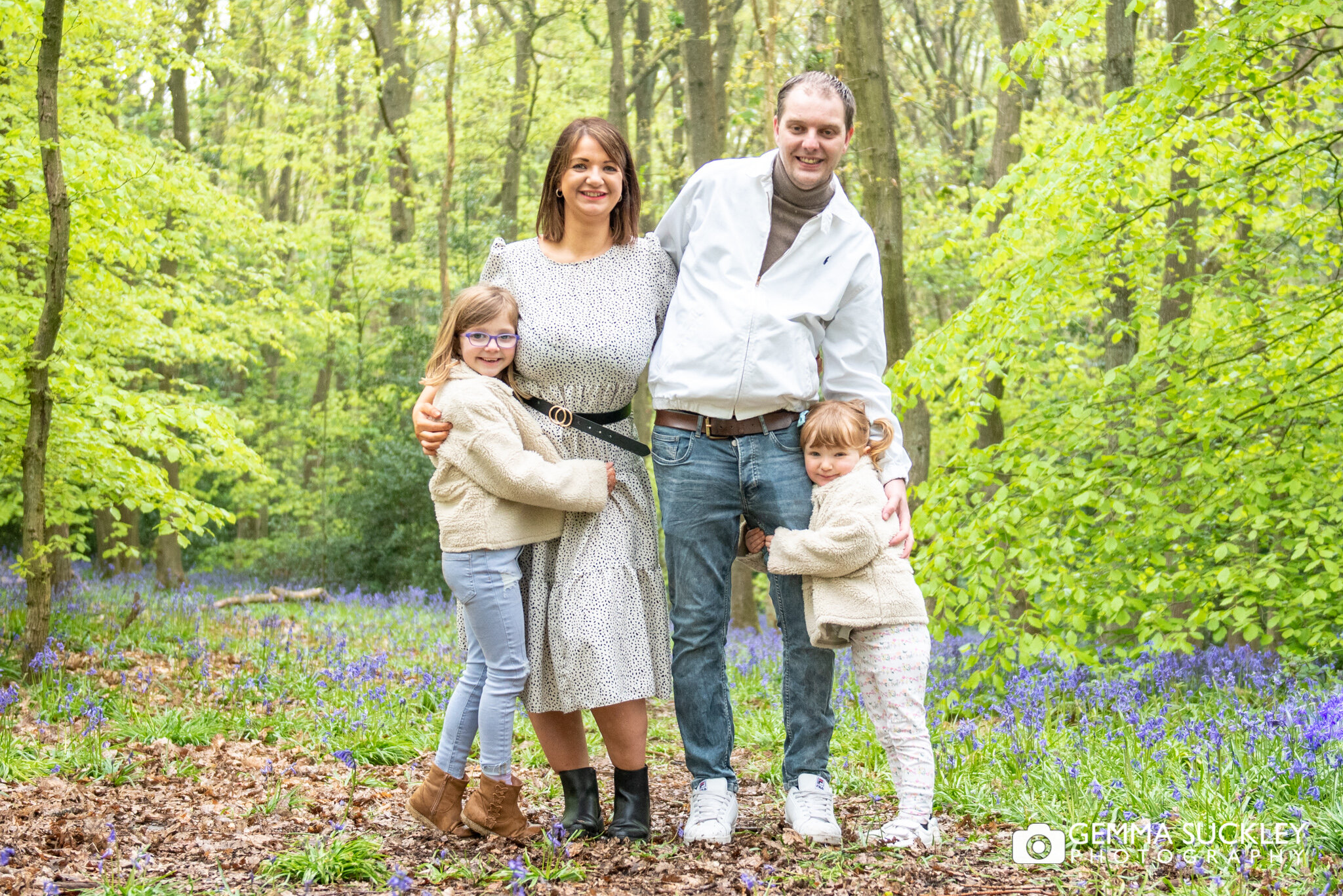 woodland engagement photo with their kids in shipley wood