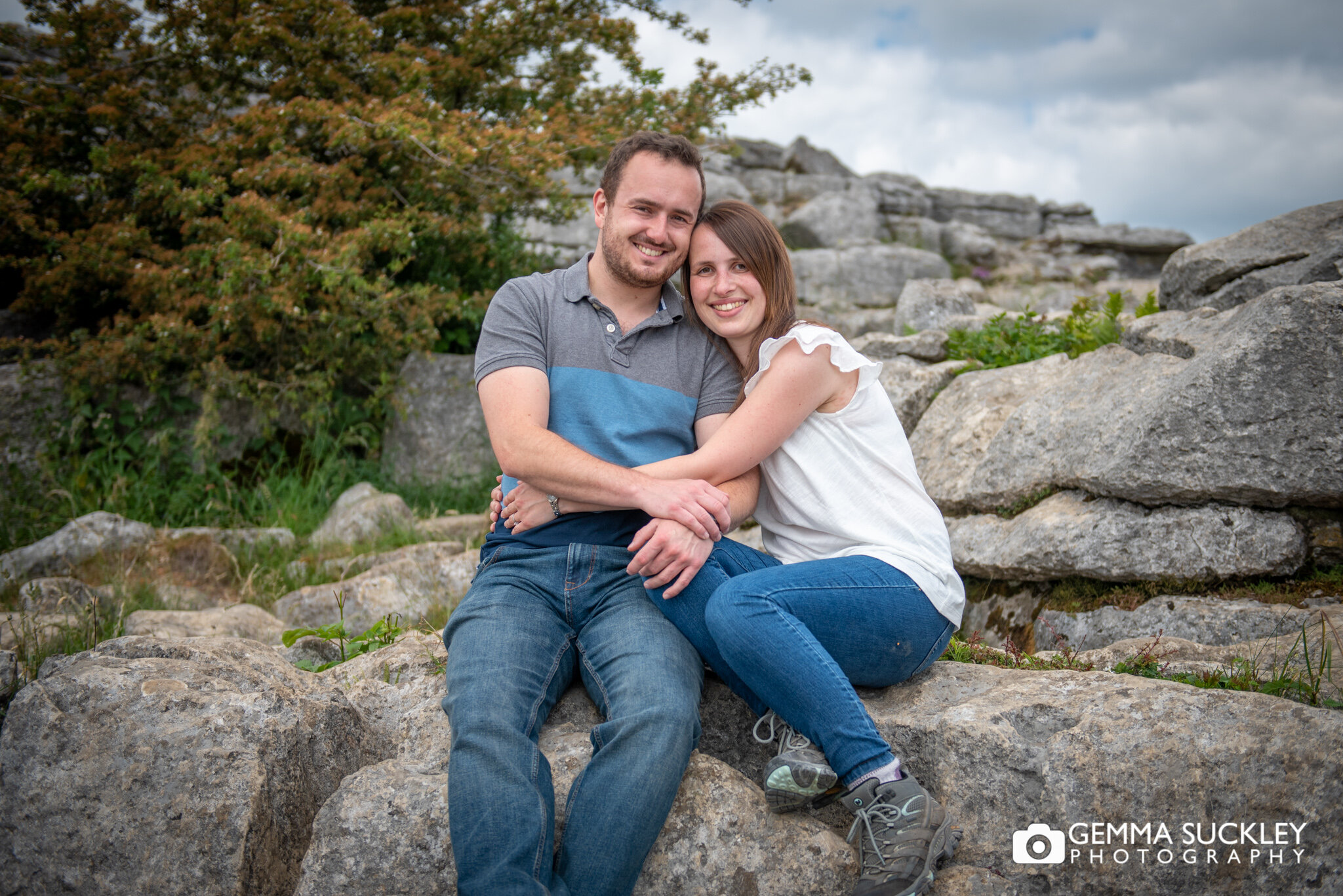 a couple smiling during their engagement shoot at malham