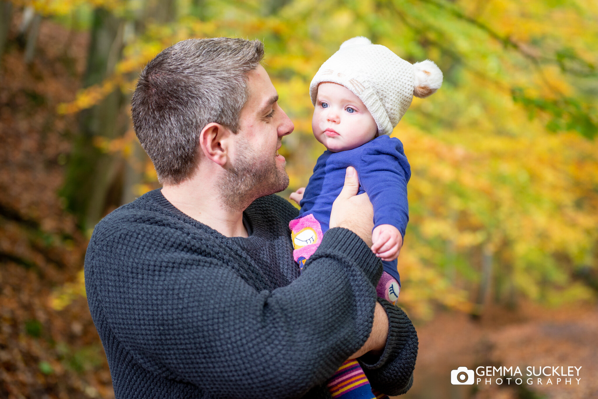 a dad holding his baby girl in skipton wood