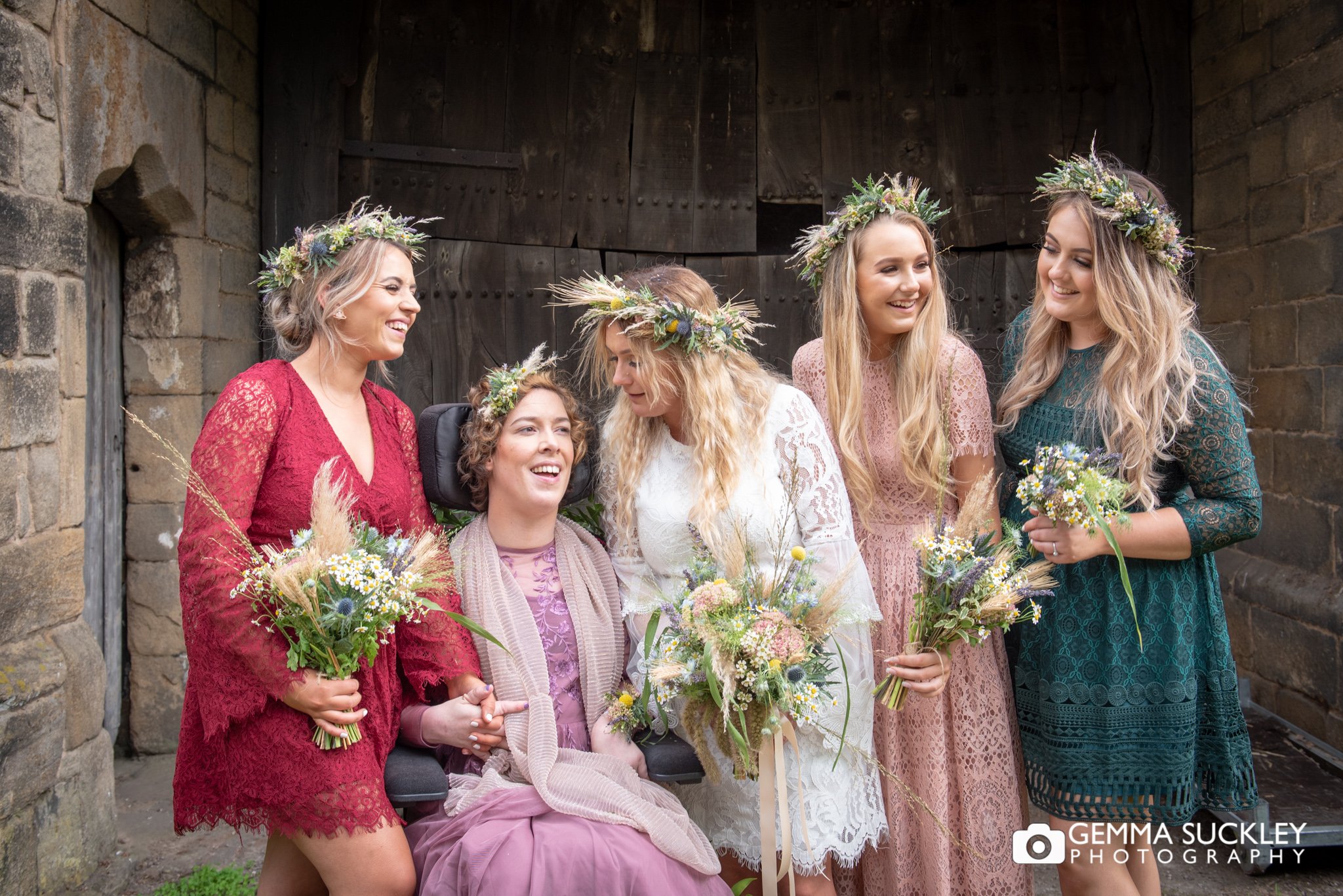 natural photo of boho bride and bridesmaid outside east riddlesden hall