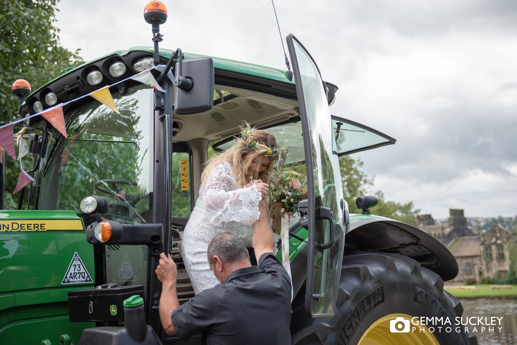 the bride exiting the tractor at east riddlesden hall