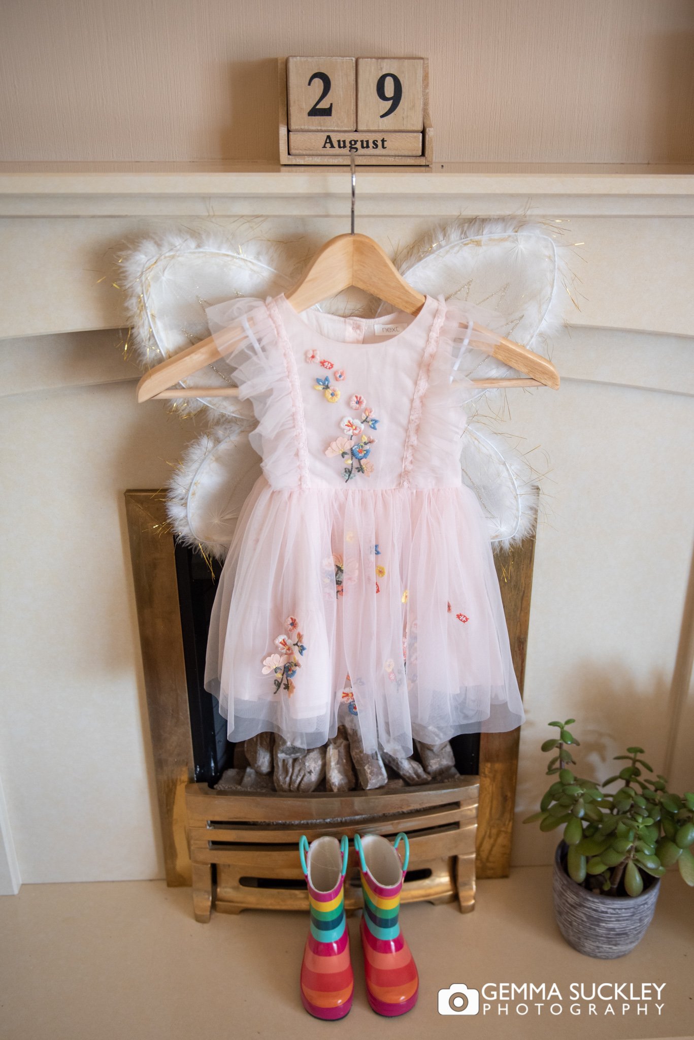 a flower girls dress with angel wings