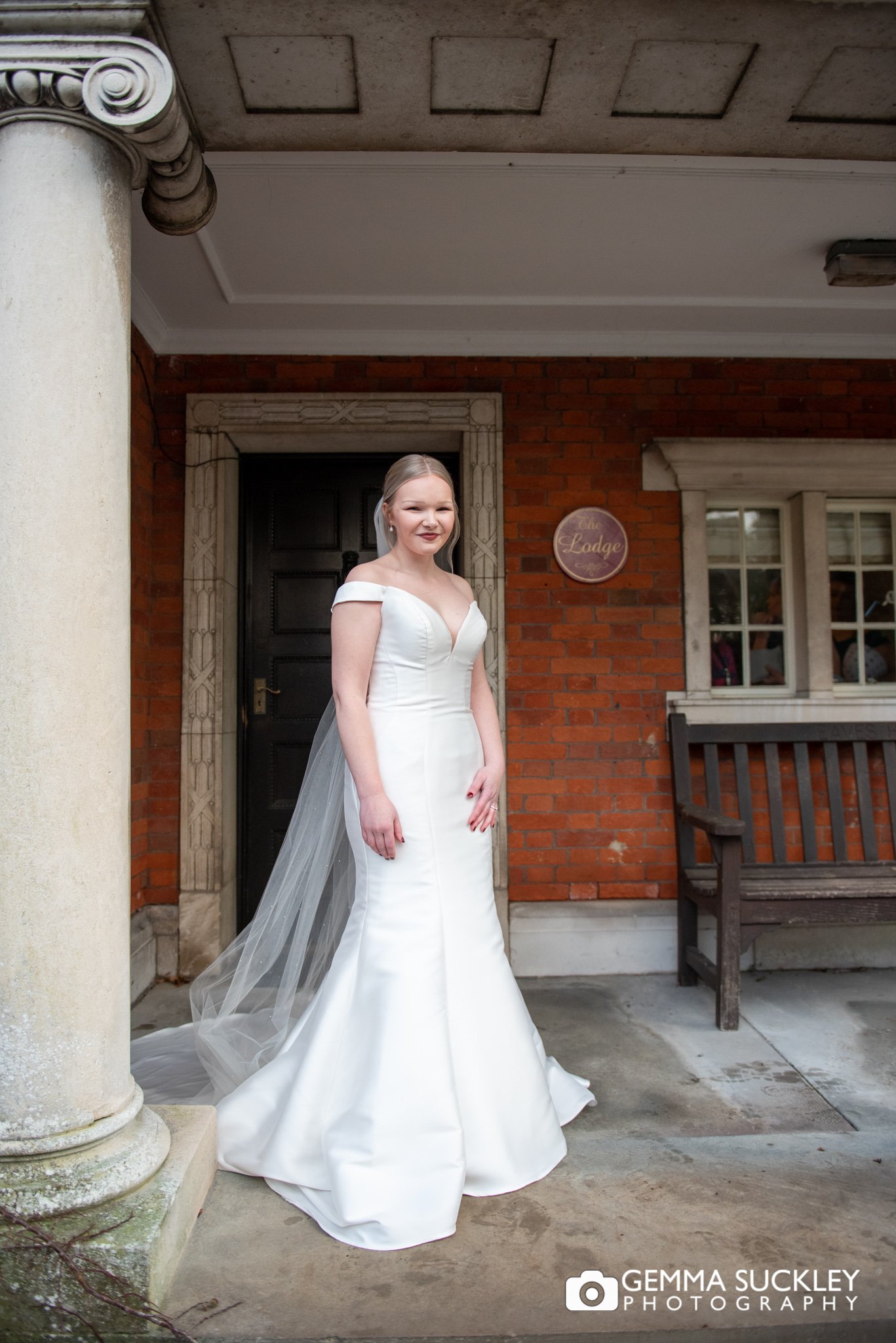 wedding portrait of a bride outside the lodge in clitheroe