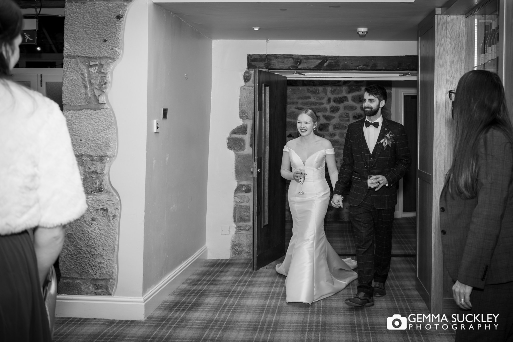 the bride and groom entering the room at coniston hotel wedding