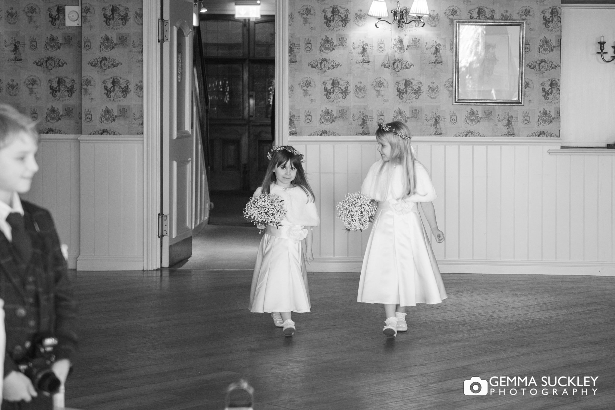 flower girls waking down the aisle at shireburn arms clitheroe