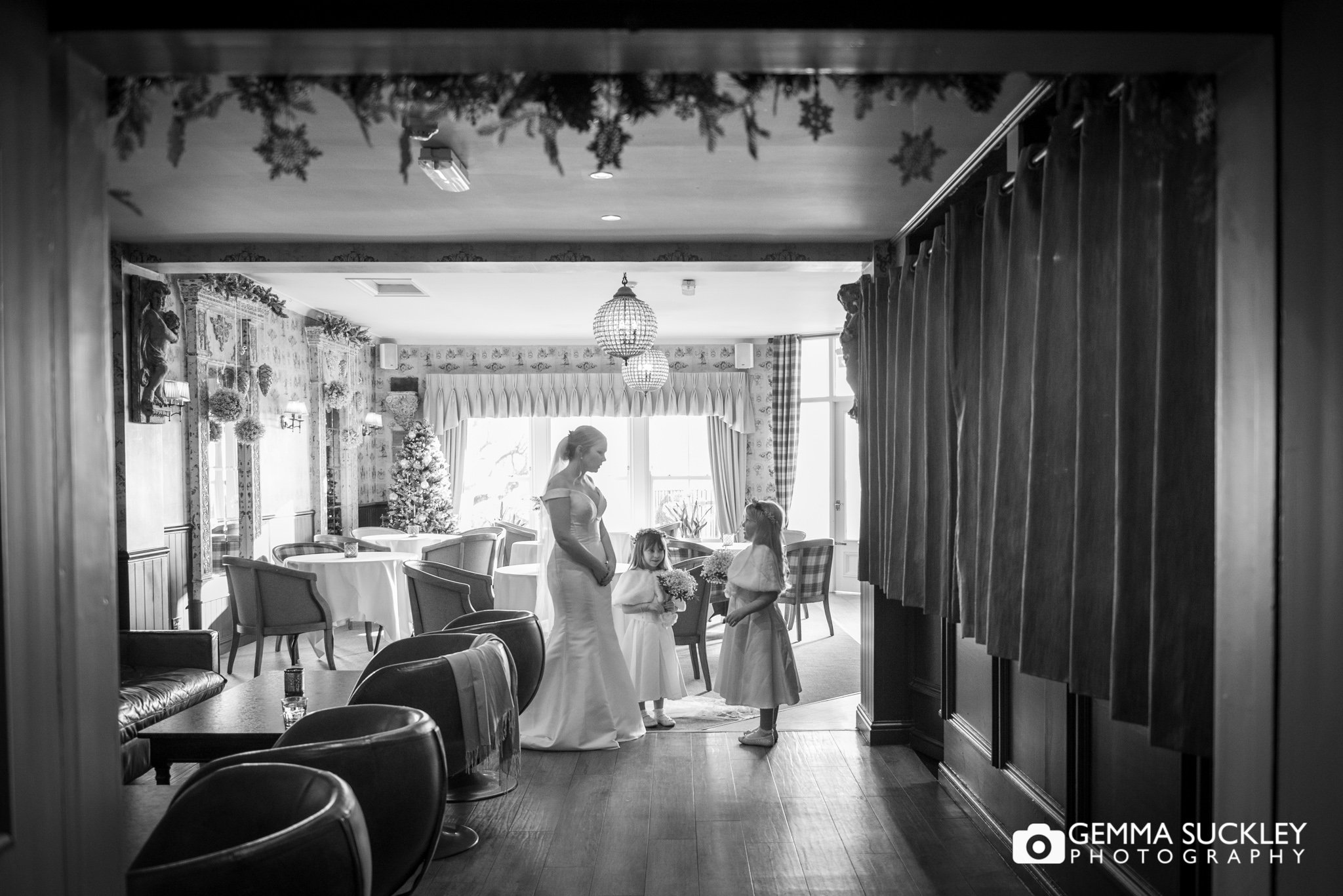 the bride waiting with the flower girls before the ceremony 