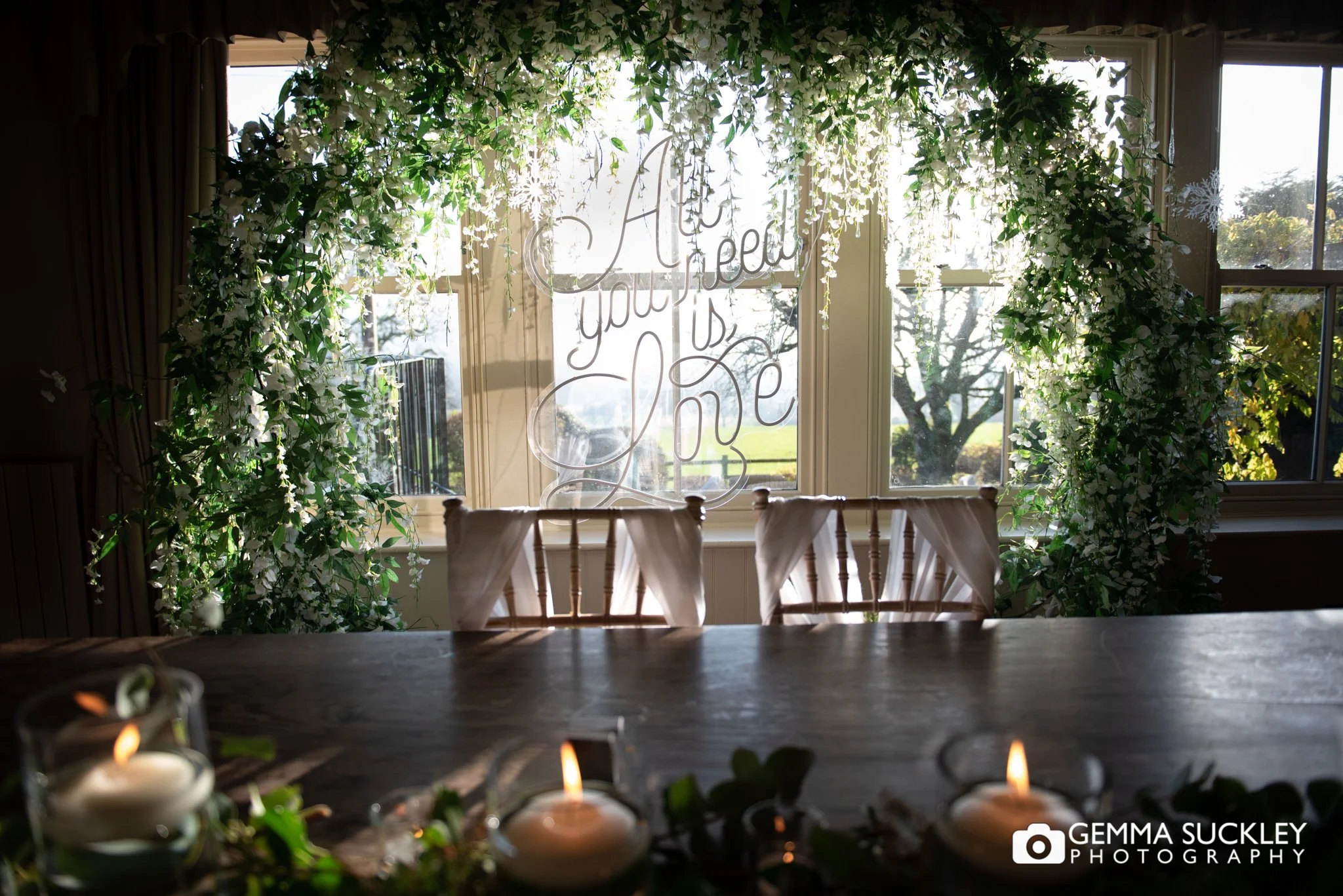 a floral archway at the shireburn arms wedding