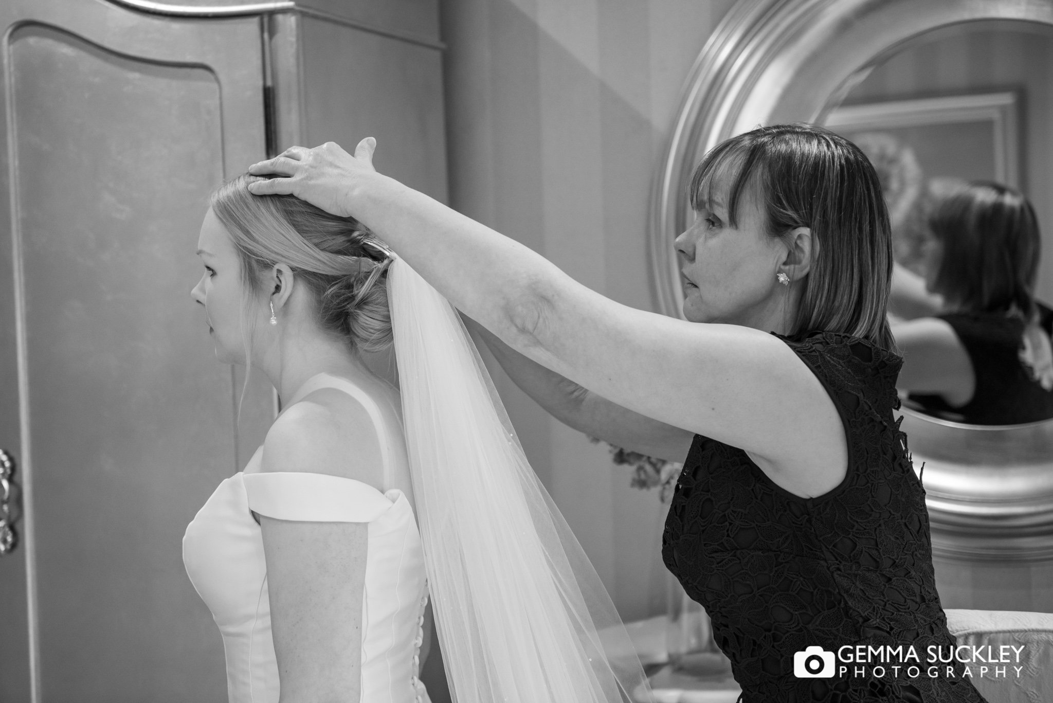 mother of the bride applying the veil at the lodge in clitheroe