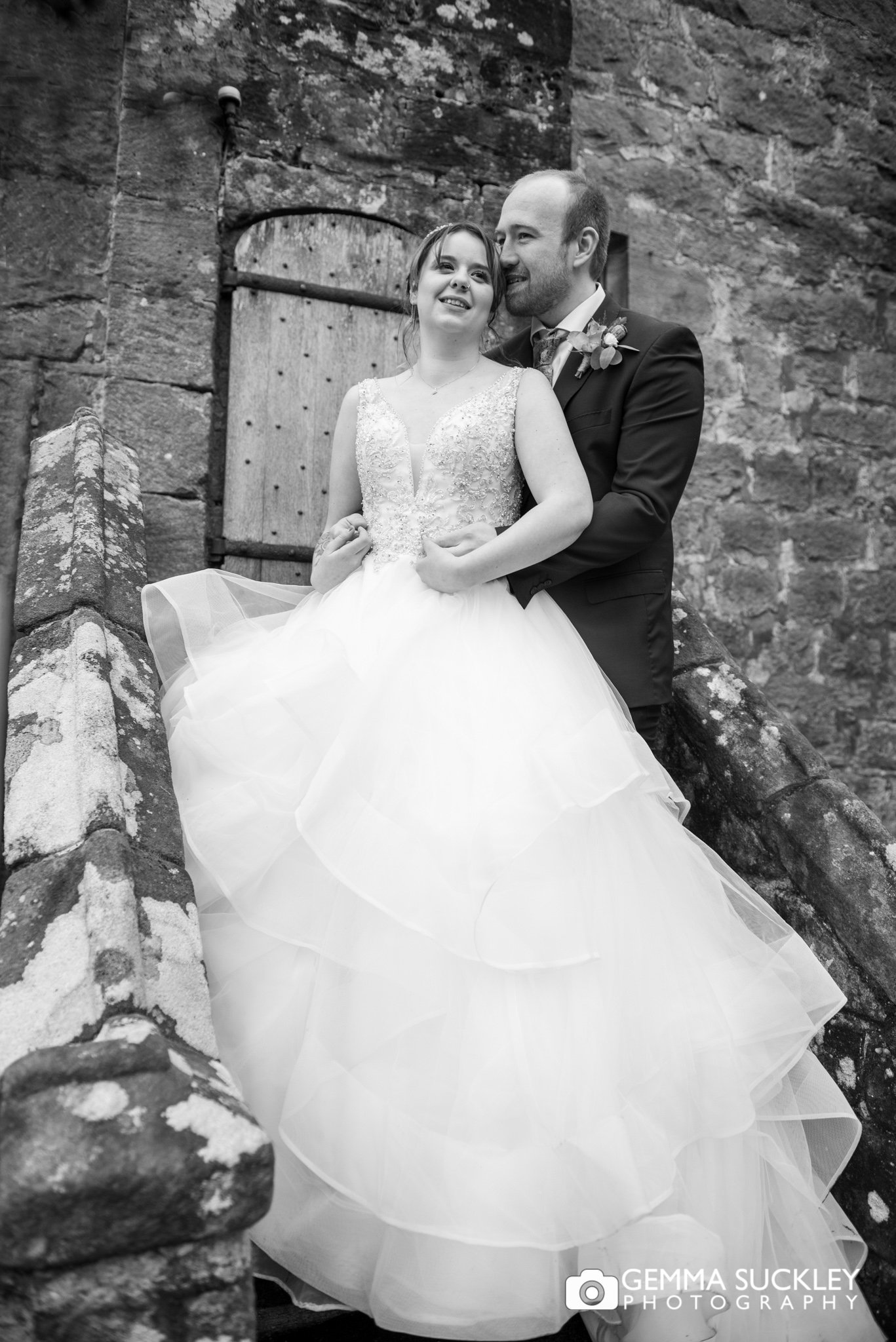 blak and white wedding photo outside the priests house in barden