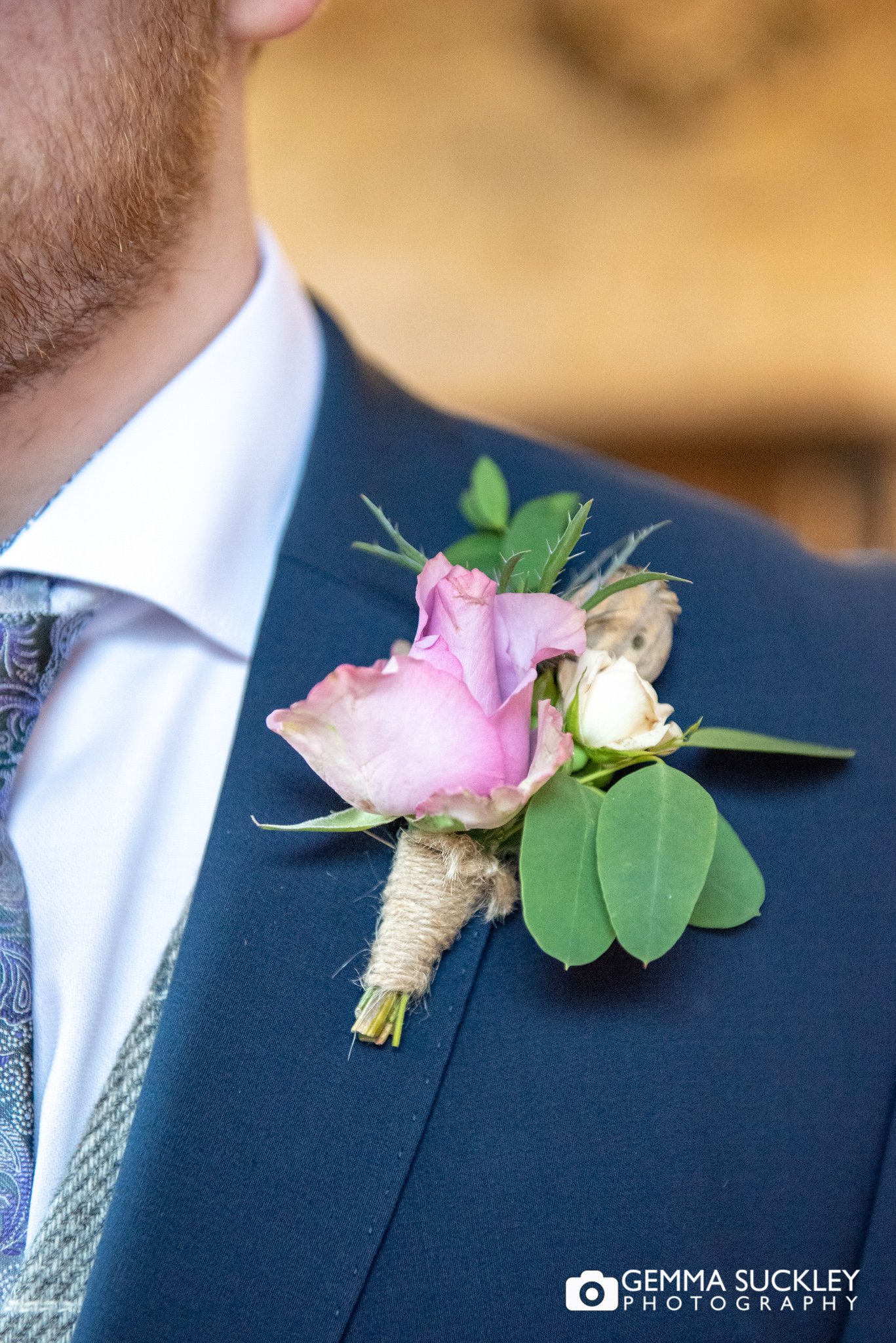 close up photo of the grooms button hole by hyde park flower club