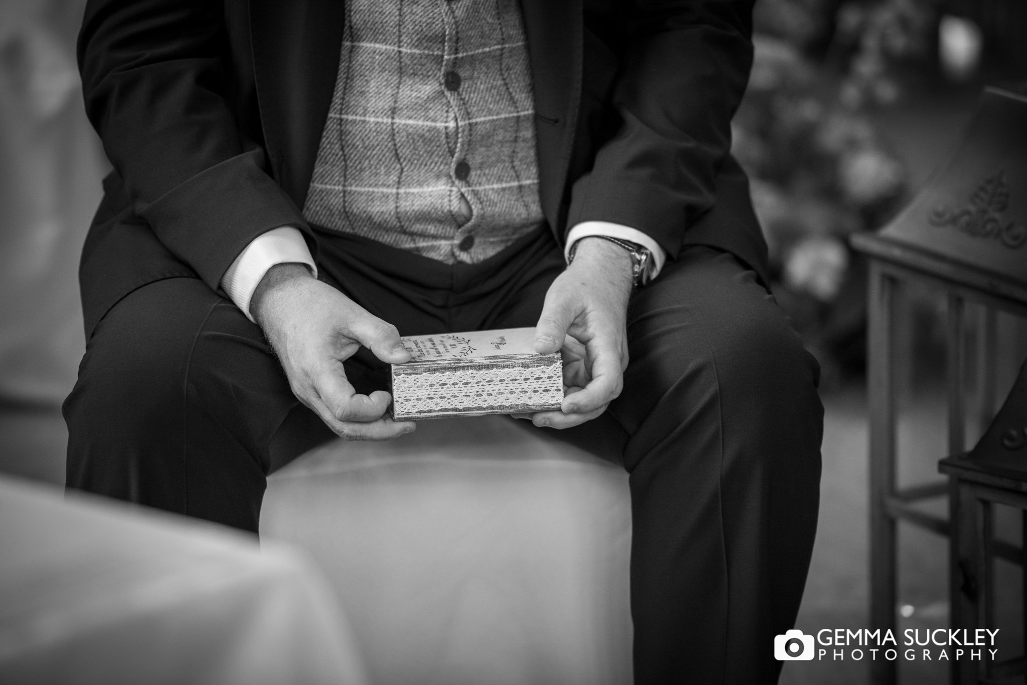 groomsman with hold the ring box